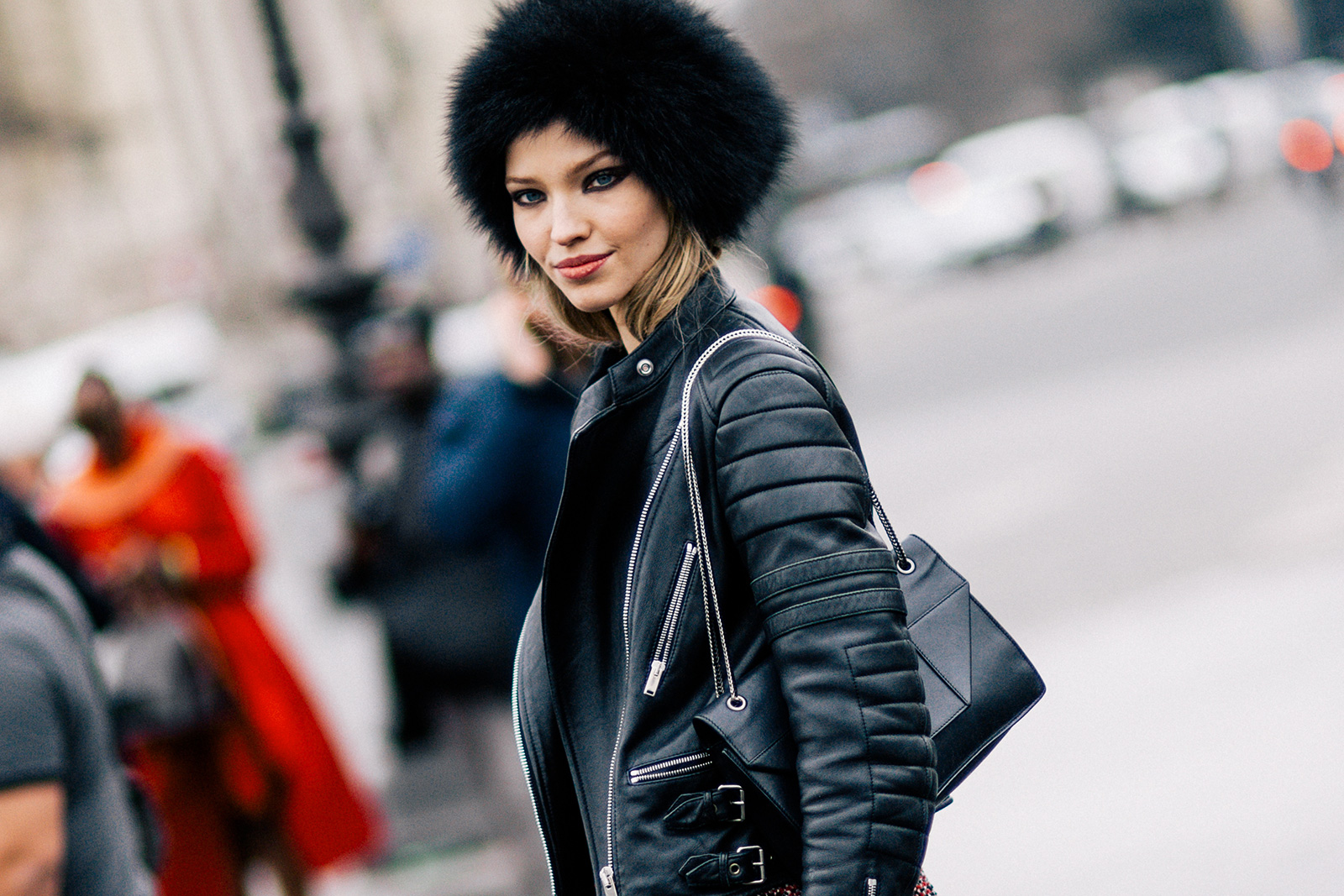 Sasha Luss wearing a leather jacket and fur hat after the Chanel Fall 2015 Fashion Show in Paris, France