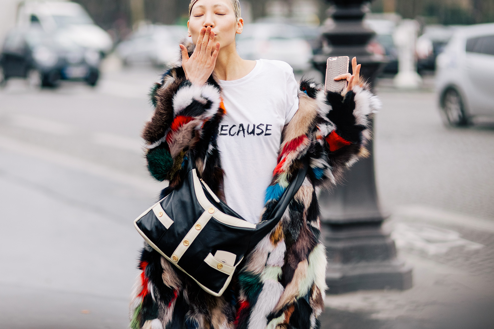 Soo Joo Park wearing leather pants, multicolored fur coat and a Chanel bag after the Chanel Fall 2015 Fashion Show in Paris, France