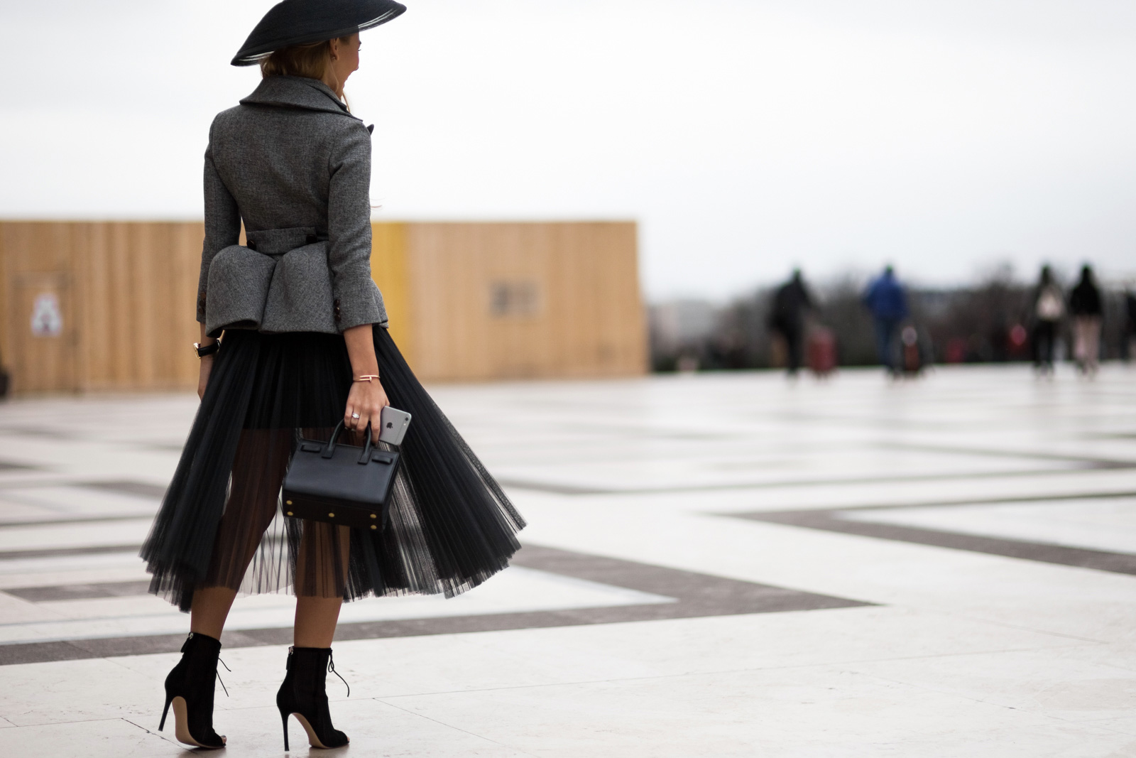 Alexandra Rakhimova wearing a Dior hat, Saint Laurent bag and Gianvito Rossi ankle boots after the Elie Saab Spring 2015 Haute Couture fashion show in Paris, France