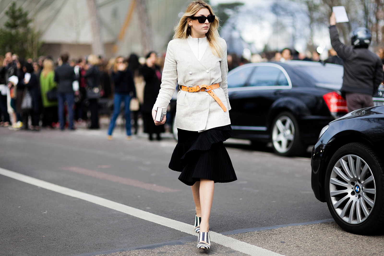 Camille Charrière wearing a Carin Wester blazer, Acne Studios belt, Thakoon ruffled skirt and Chloe wedges, before the Louis Vuitton Fall 2015 fashion show in Paris, France