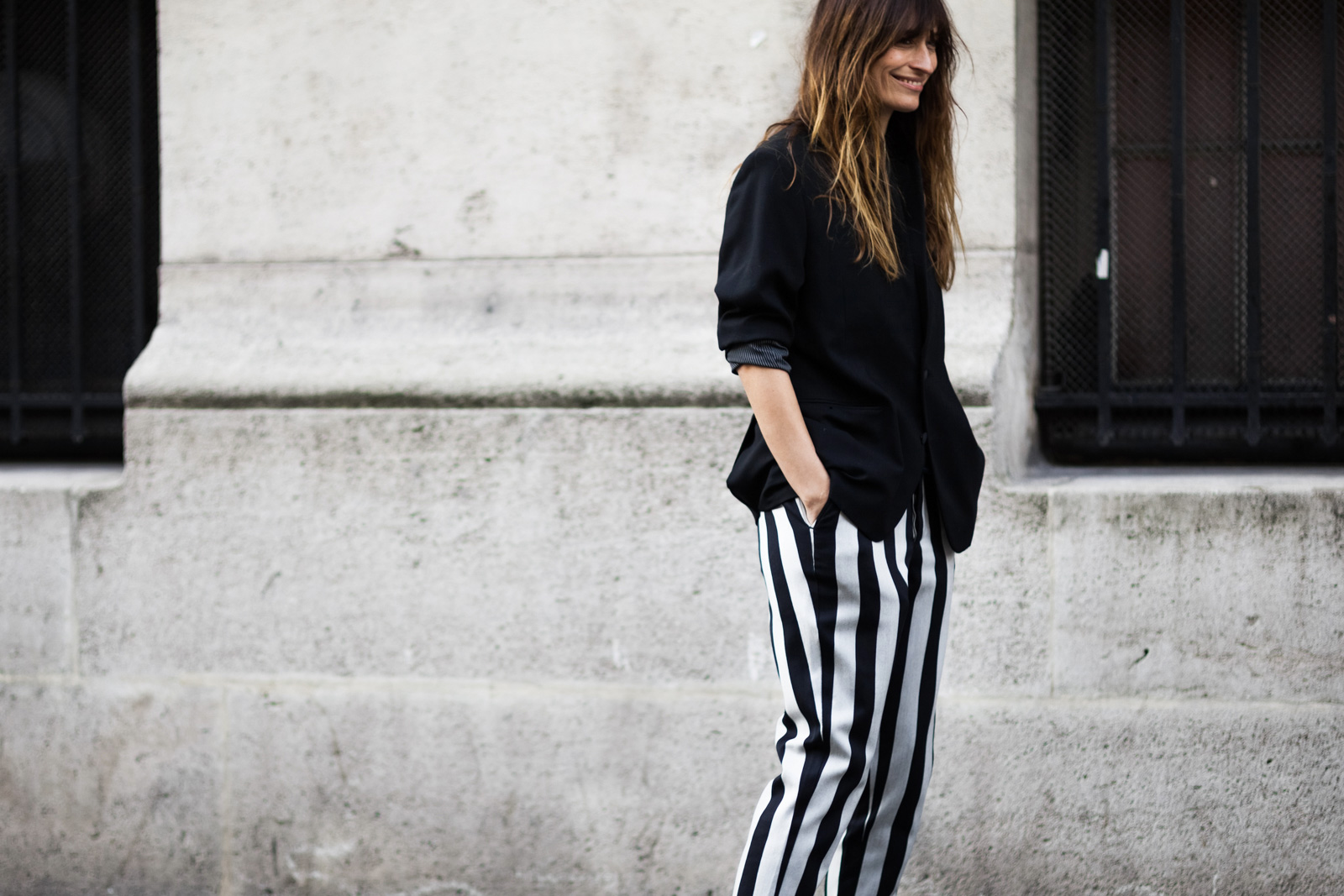 Caroline De Maigret wearing AMI striped pants and black blazer after the Haider Ackermann Fall/Winter 2015-2016 fashion show in Paris, France