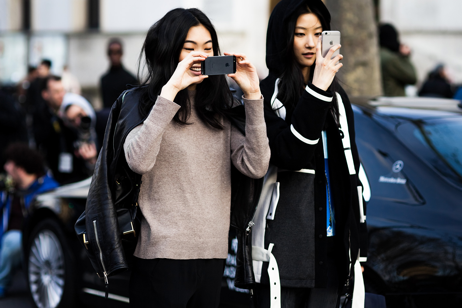 Models Chiharu Okunugi + JiHye Park after the Balmain Fall 2015 fashion show in Paris, France 