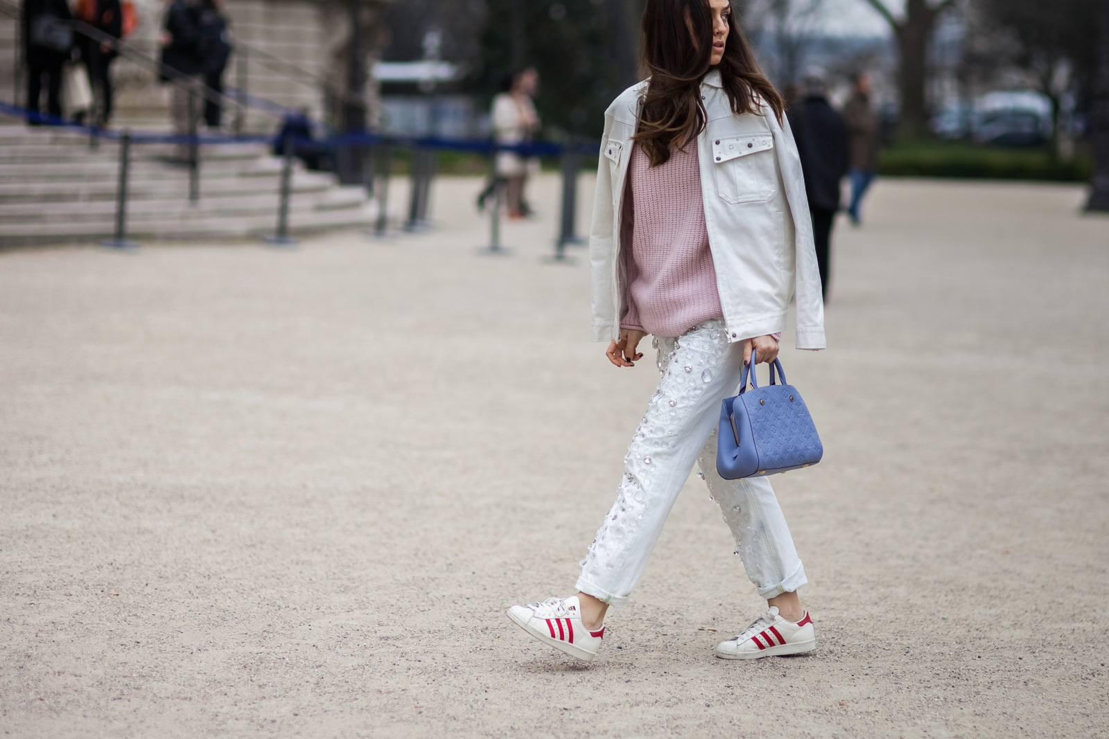Erika Boldrin wearing Dondup embellished jeans, pink sweater, white denim jacket, Louis Vuitton bag and Adidas sneakers before the Chanel Fall/Winter 2015-2016 fashion show in Paris, France