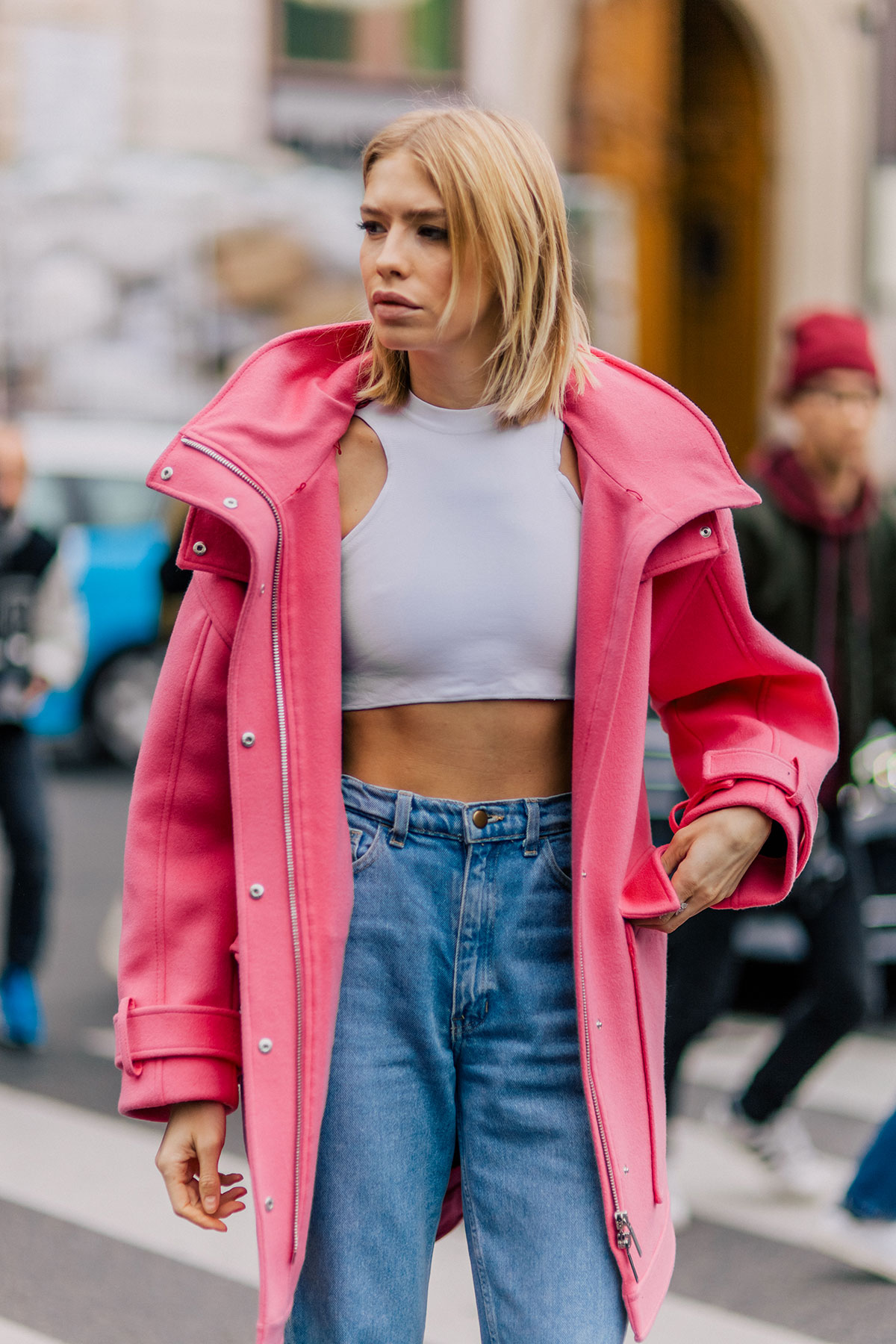 Elena Perminova wearing a pink Emilio Pucci coat, Versace cropped top and Dior shoes after the Stella McCartney Fall/Winter 2015-2016 fashion show in Paris, France