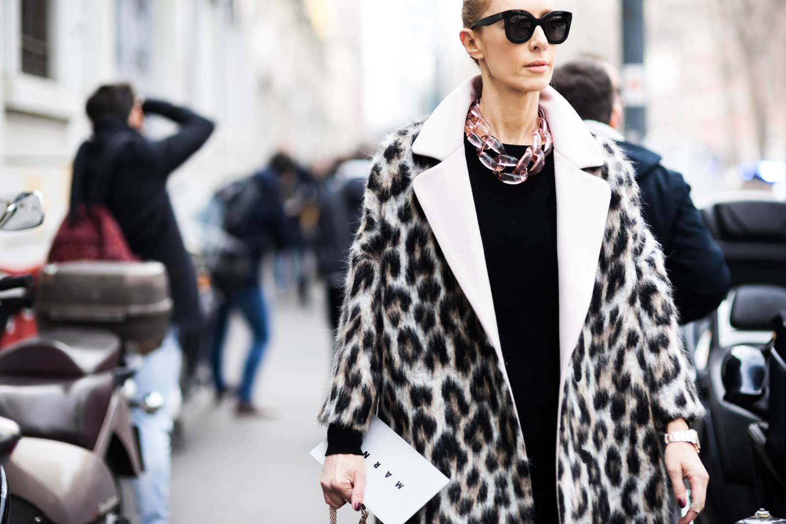 Elina Halimi wearing a MSGM leopard print coat, black leather pants, Burberry Prorsum sneakers and a Valentino studded bag after the Marni Fall/Winter 2015-2016 fashion show in Milan, Italy