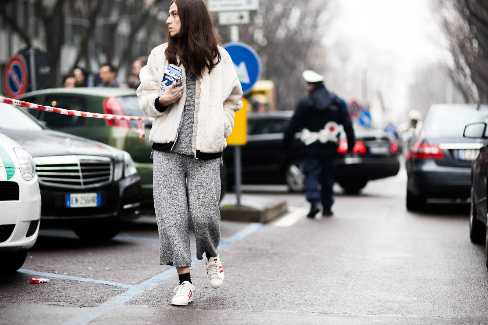 Erika Boldrin wearing knitted sweater and pants and Adidas superstar sneakers outside the Armani Fall/Winter 2015-2016 fashion show in Milan, Italy