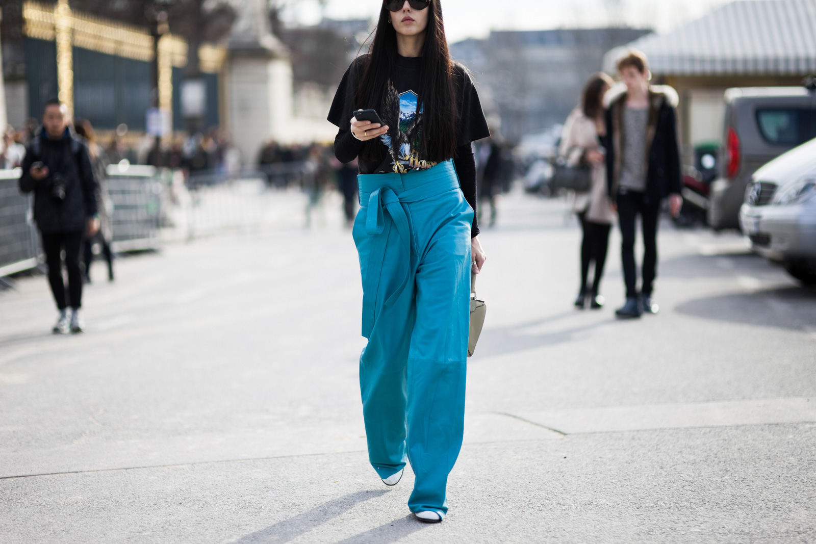Gilda Ambrosio wearing leather Loewe pants and Loewe bag after the Elie Saab Fall /Winter 2015-2016 fashion show at the Tuileries in Paris, France