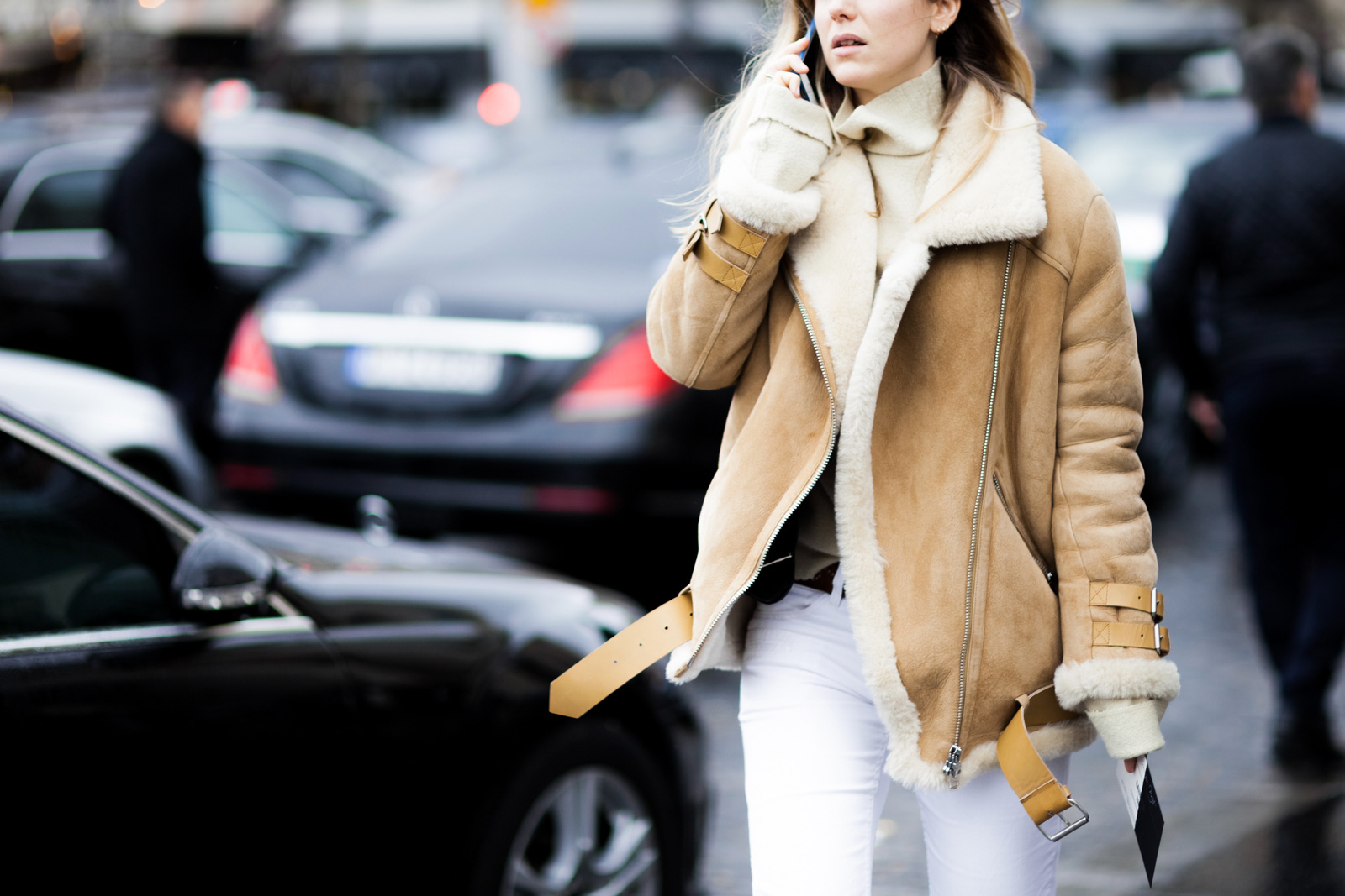 Jennifer Neyt wearing white jeans and Acne Studios shearling jacket after the Elie Saab Haute Couture fashion show in Paris, France