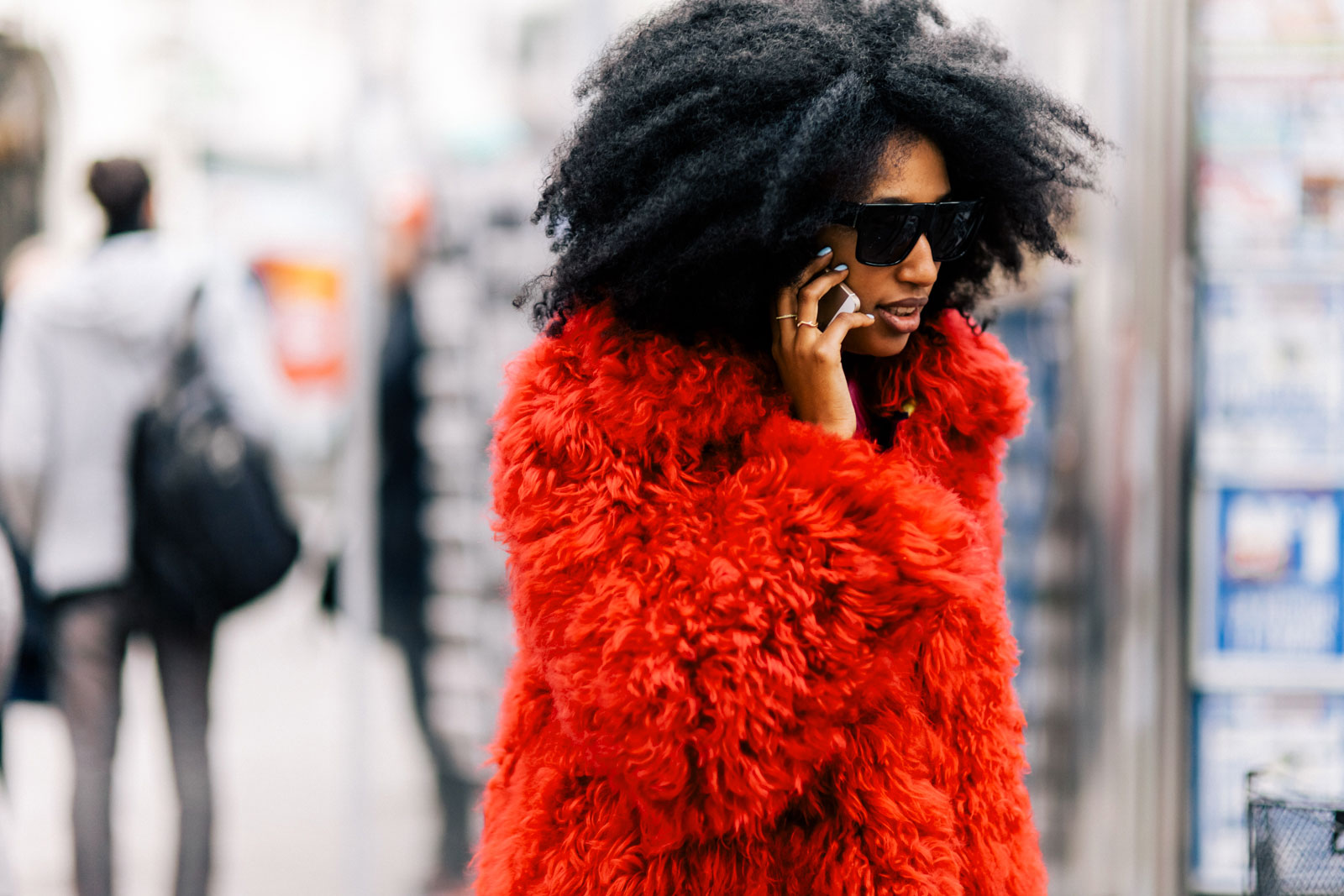 Julia Sarr Jamois wearing a Philosophy di Lorenzo Serafini red fur coat and Celine sunglasses before the Stella McCartney Fall/Winter 2015-2016 fashion show in Paris, France