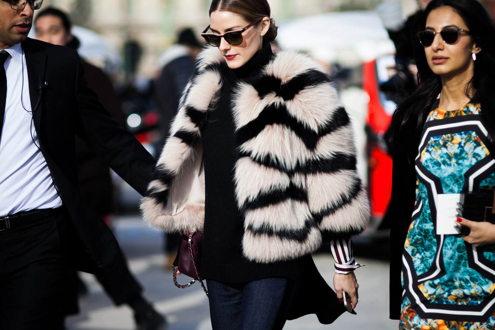 Olivia Palermo wearing a black sweater, Elie Saab jeans, fur jacket and handbag after the Elie Saab Fall/Winter 2015-2016 fashion show at the Tuileries in Paris, France