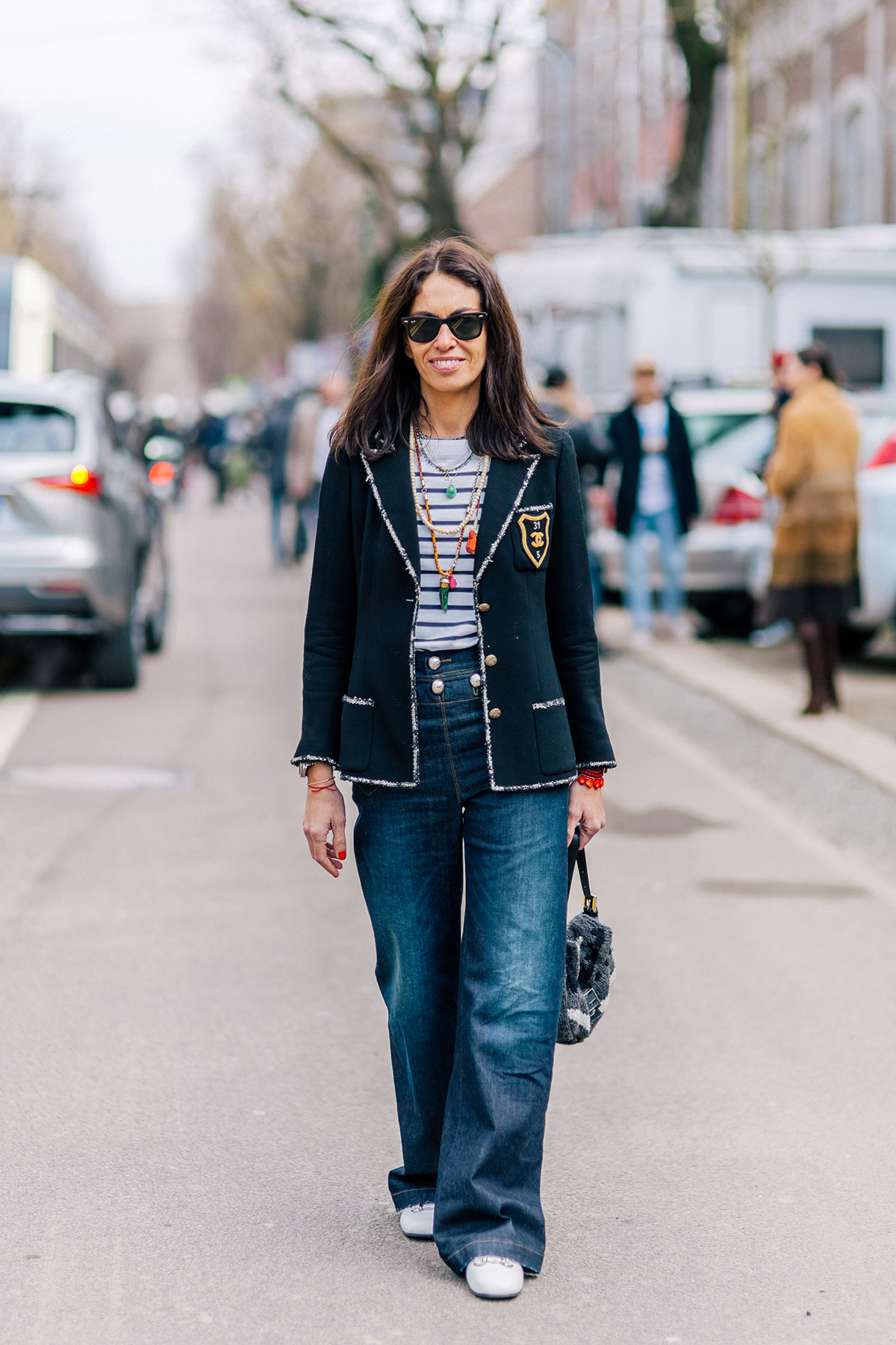 Viviana Volpicella wearing a Chanel jacket, Gucci jeans and shoes and Fendi bag before the Fendi Fall/Winter 2015-2016 fashion show in Milan, Italy