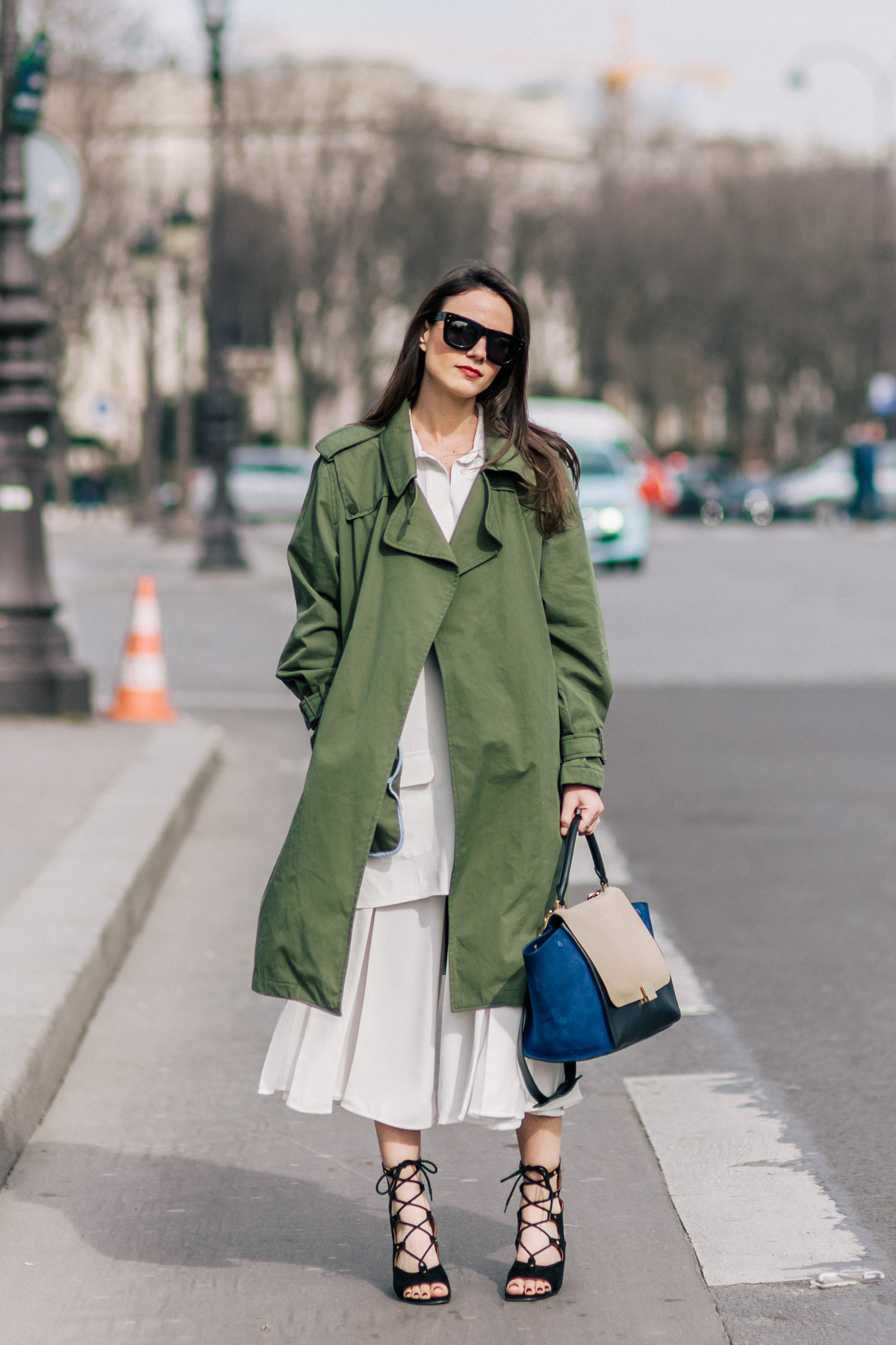 Fashion blogger Zina Charkoplia wearing Zara coat, Celine bag, Chloe shoes, Reiss skirt and ASOS sunglasses before the Chloe Fall/Winter 2015-2016 fashion show in Paris, France.