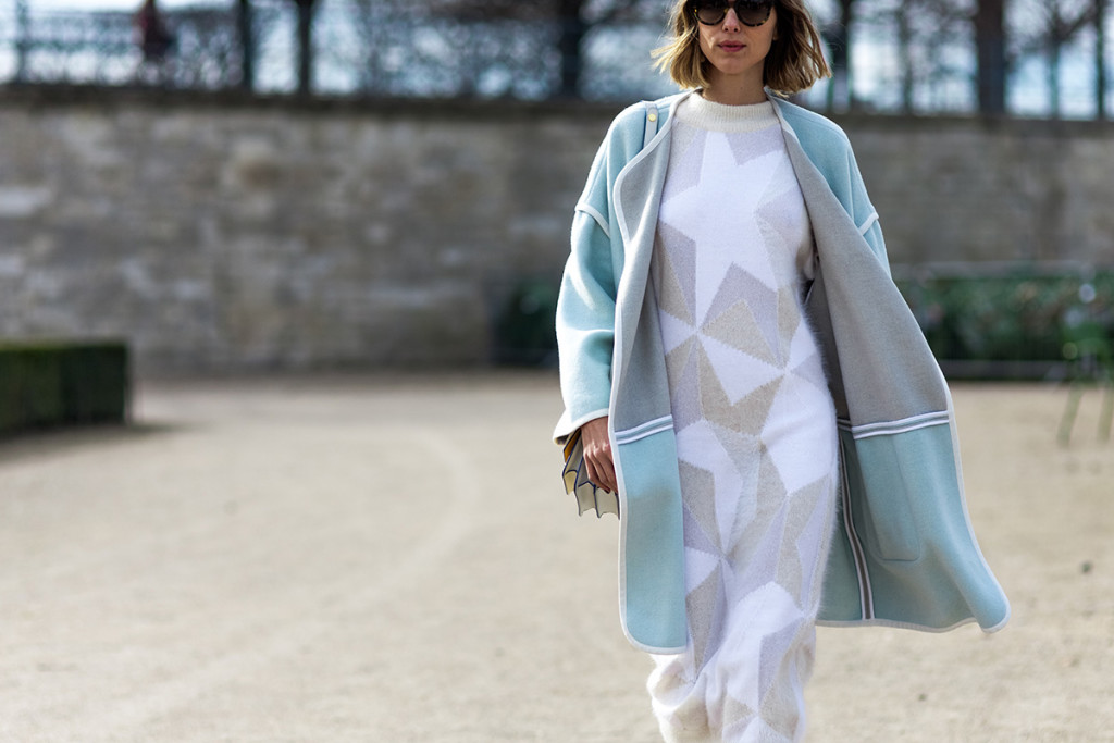 Candela Novembre wearing a lightblue coat and knitted dress in Paris, France