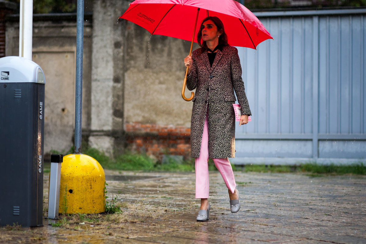 Stylist Carine Roitfeld wearing a leopard coat and pink pants before the Gucci show in Milan, Italy 