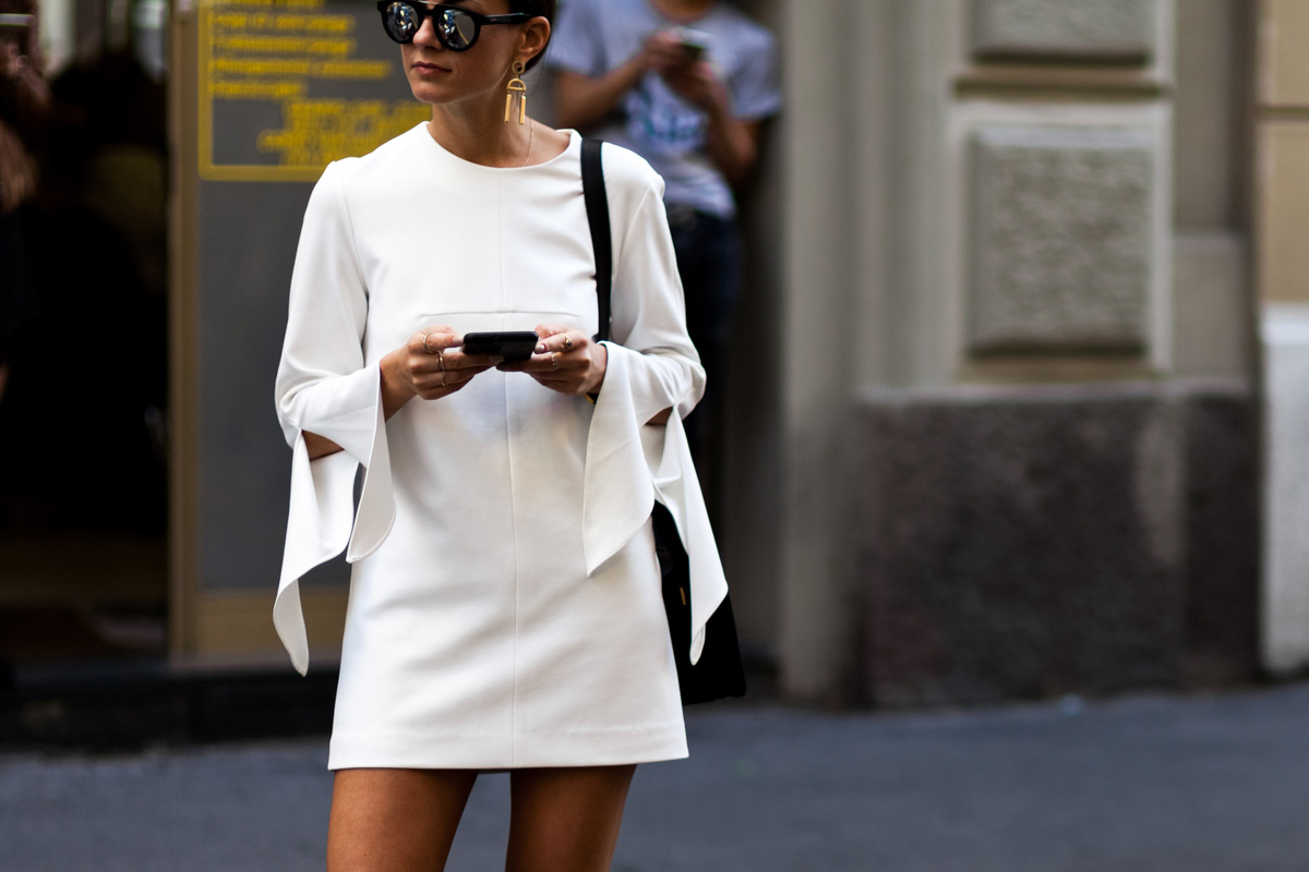 Zina Charkoplia wearing a white mini dress after a fashion show in Milan, Italy