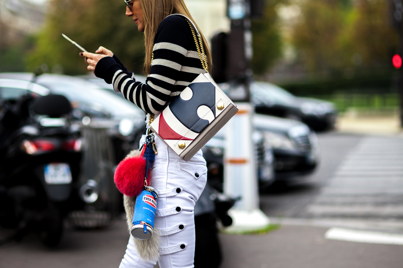 Anna Dello Russo wearing Isabel Marant outfit and Anya Hindmarch bags after a show at Paris Fashion Week