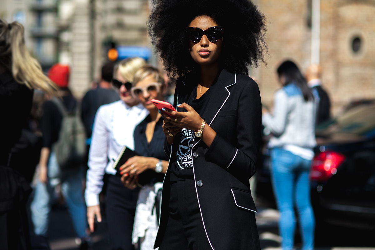 Julia Sarr-Jamois wearing a black Gucci blazer and graphic t-shirt after a show in Milan, Italy