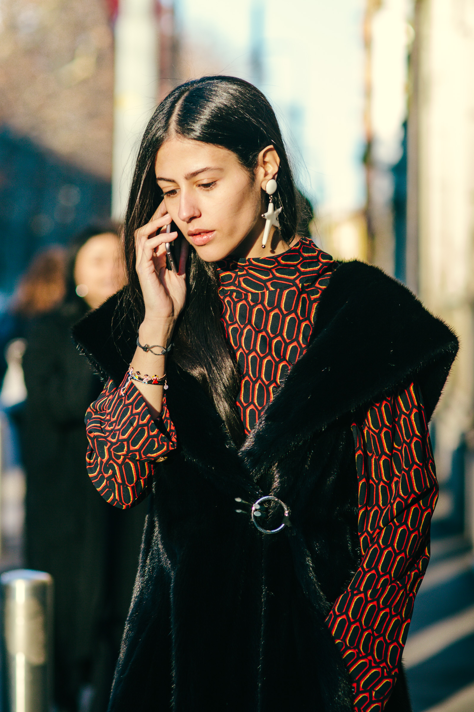 Gilda Ambrosio wearing a printed blouse and fur dress after the Marni Men's Fahsion show in Milan, Italy