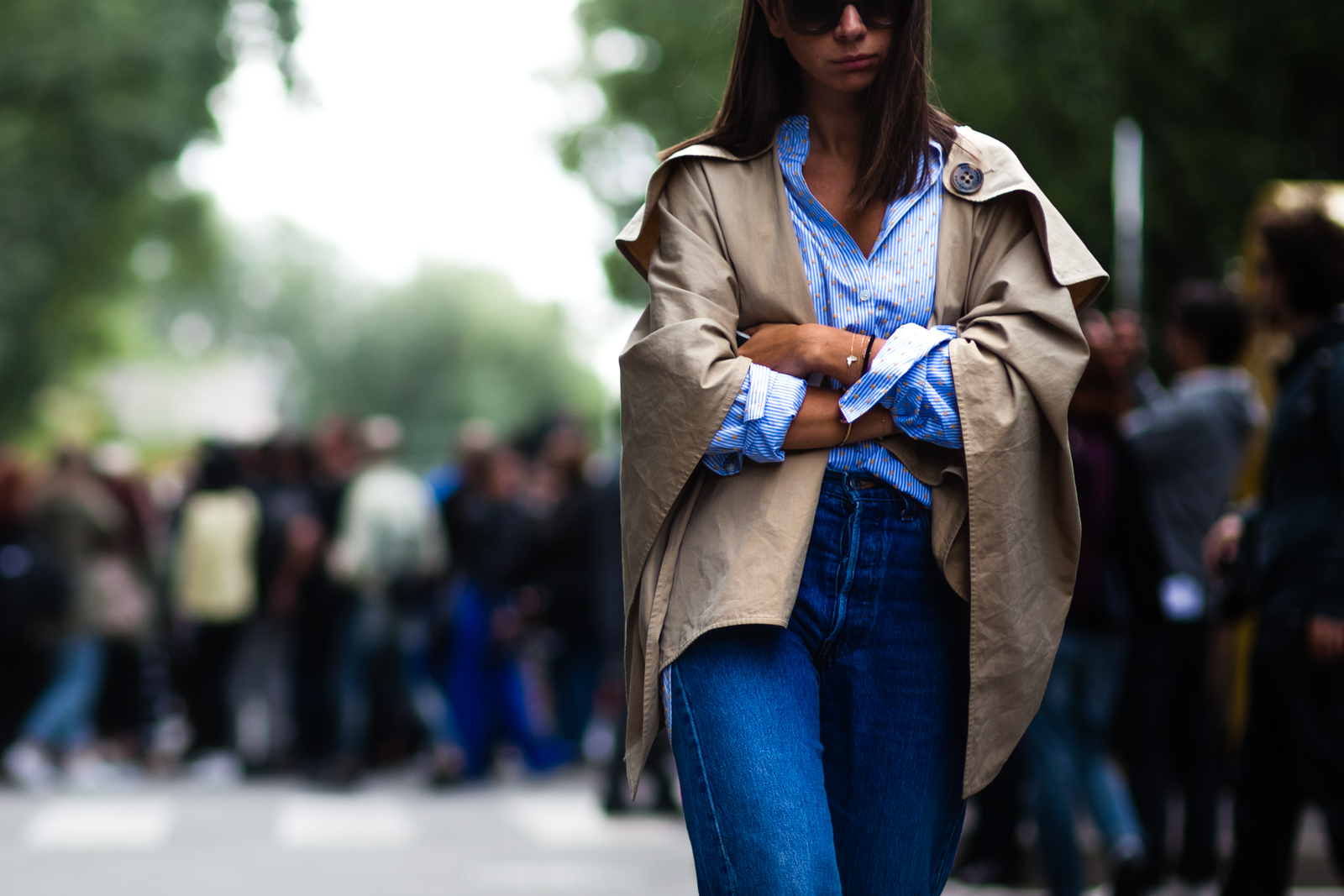 Natasha Goldenberg wearing a short trench coat and Levi's jeans before a show in Milan, Italy