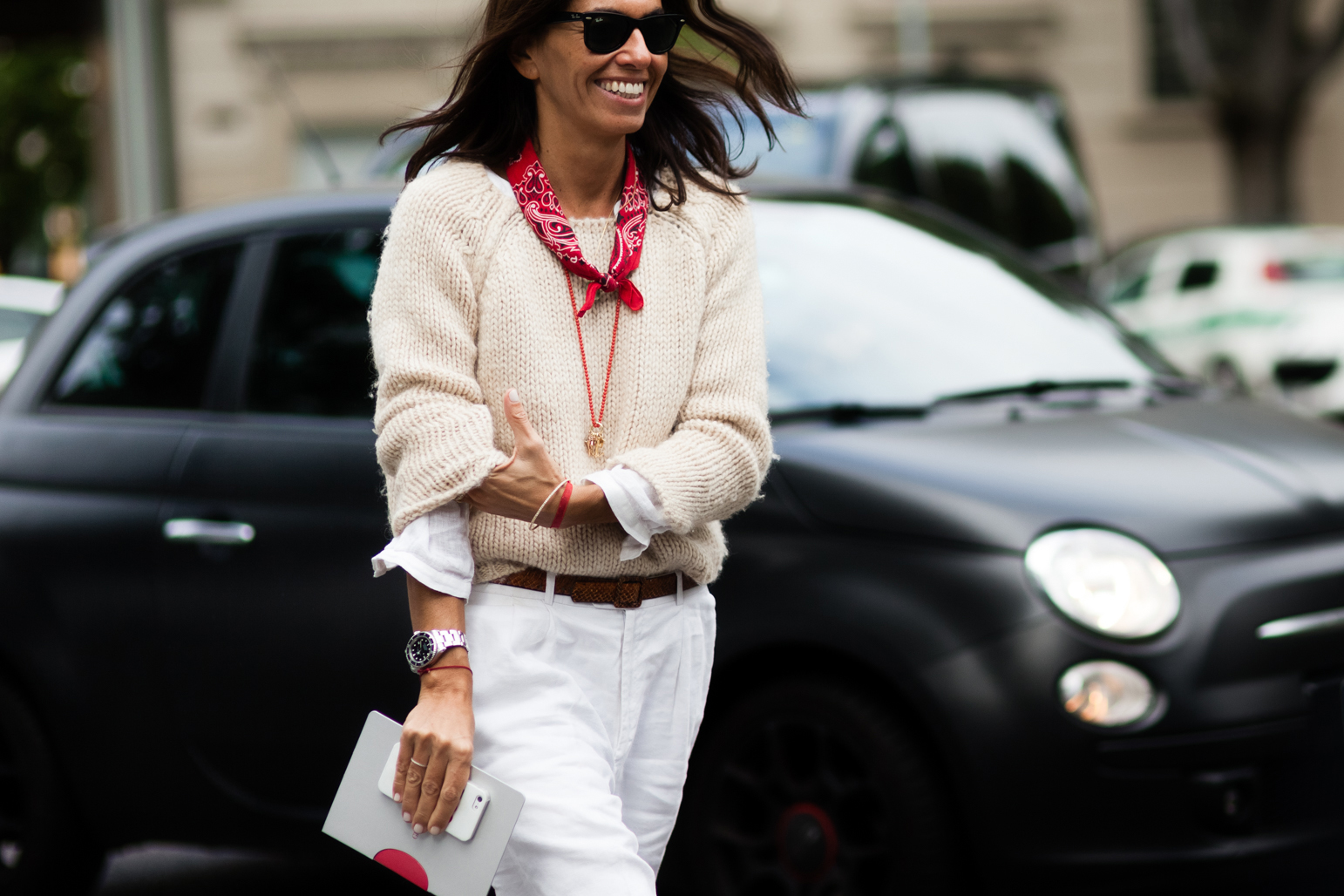 Viviana Volpicella wearing a white outfit and a red bandana scarf in Milan, Italy