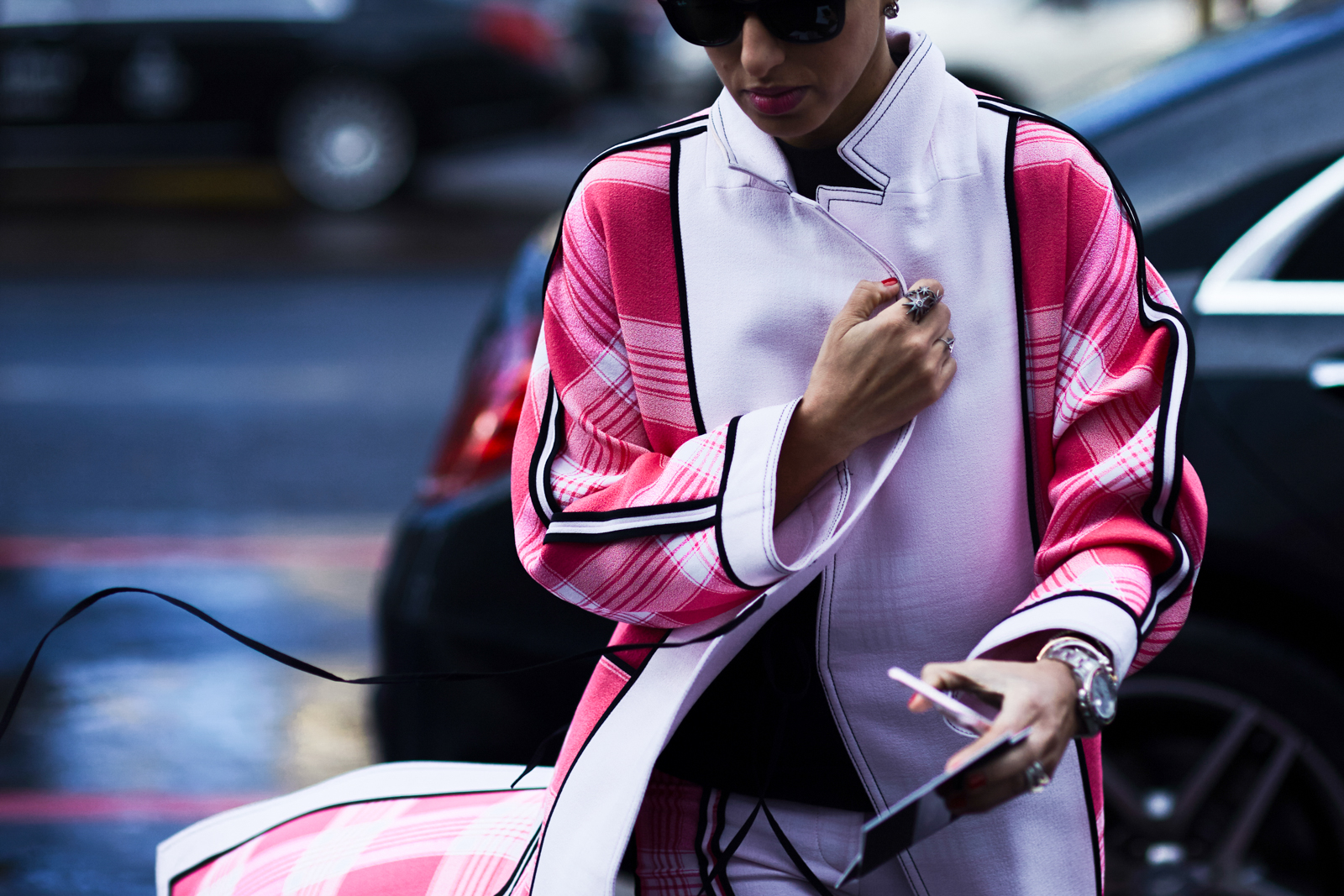 PFW Street Style: Deena Abdulaziz wearing a pink check coat by Acne Studios before a fashion show in Paris, France