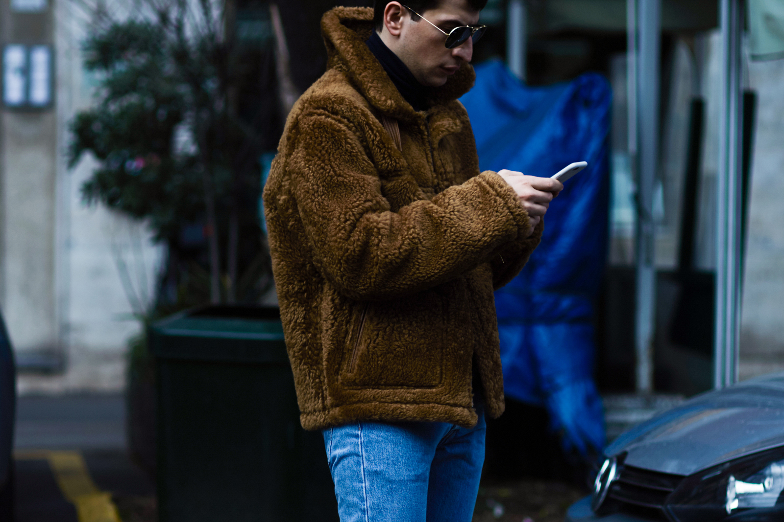 MFW Street Style: Fashion editor Konstantin Spachis wearing a shearling jacket and jeans after a show in Milan, Italy
