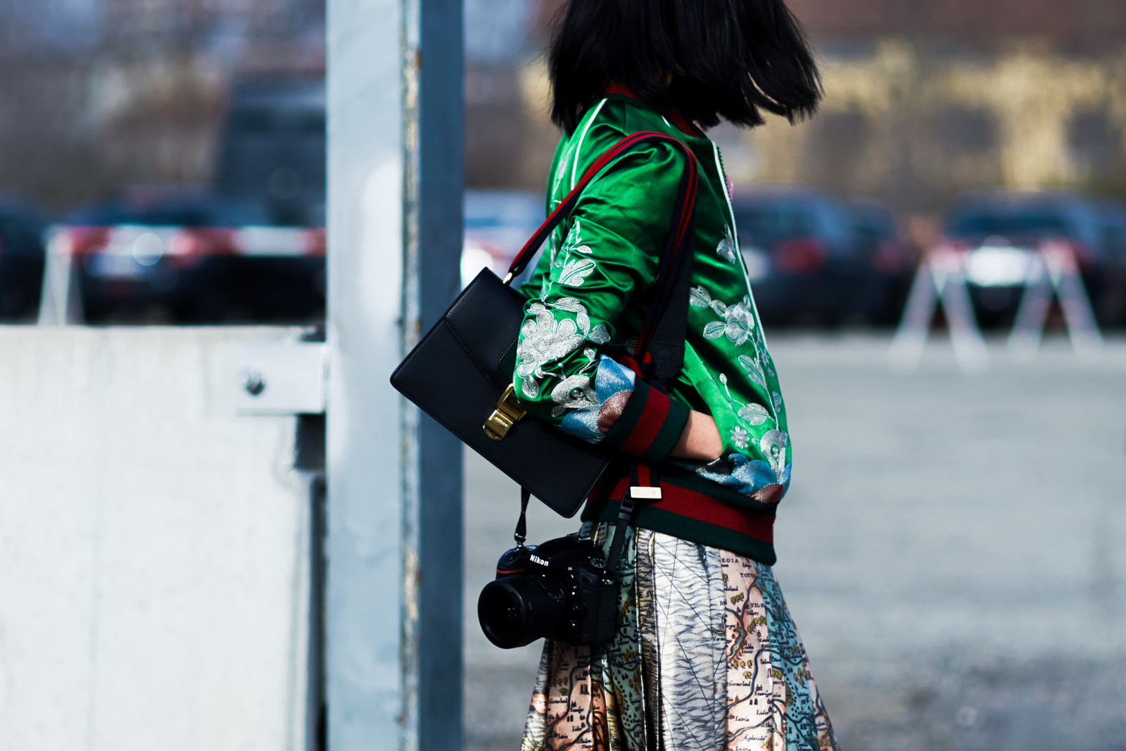 MFW Street Style: Blogger Margaret Zhang wearing a Gucci bomber jacket, Gucci skirt ang bag before the Gucci Fall/Winter 2016-17 fashion show in Milan