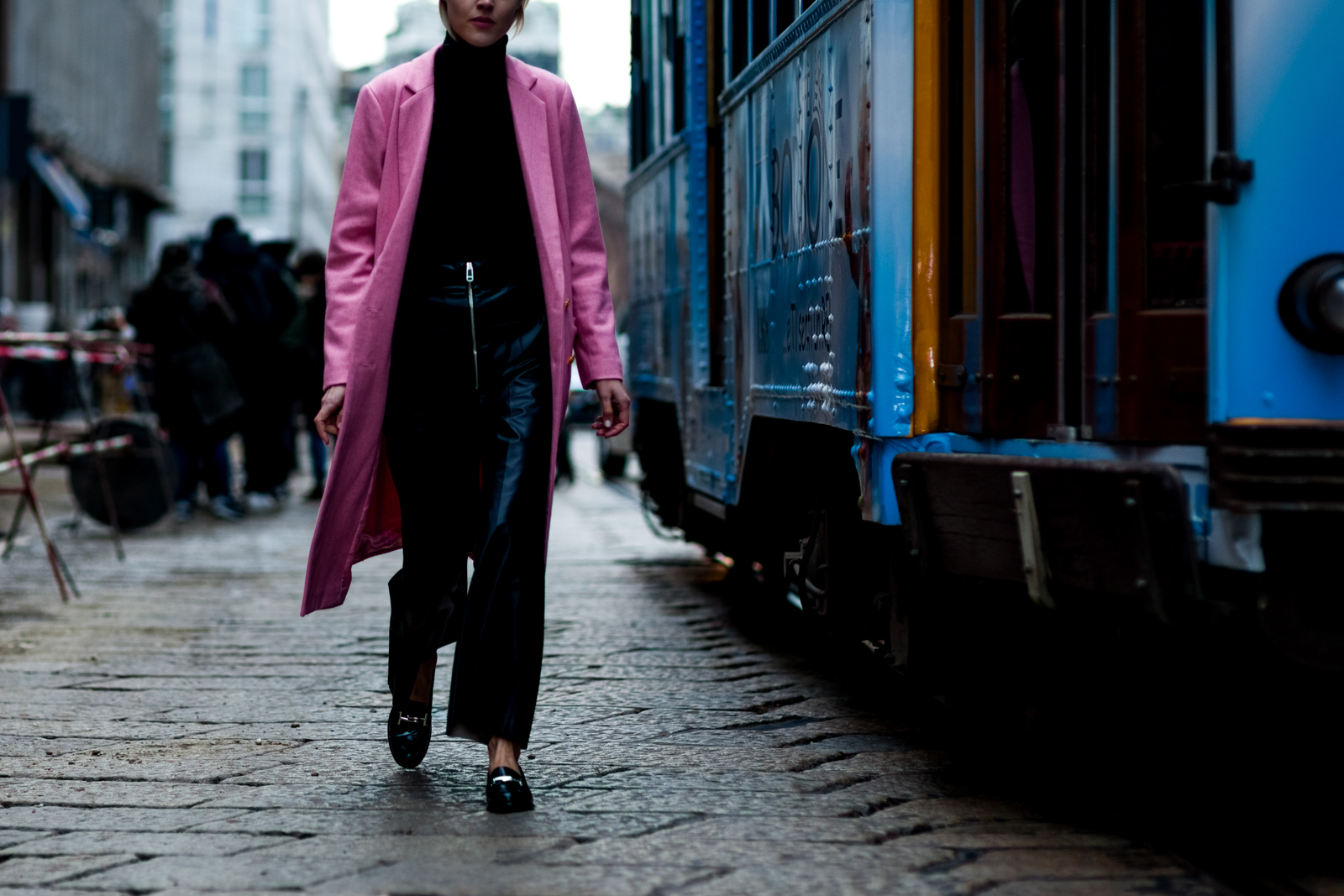 Linda Tol wearing a pink coat and black leather pants before a show in Milan, Italy