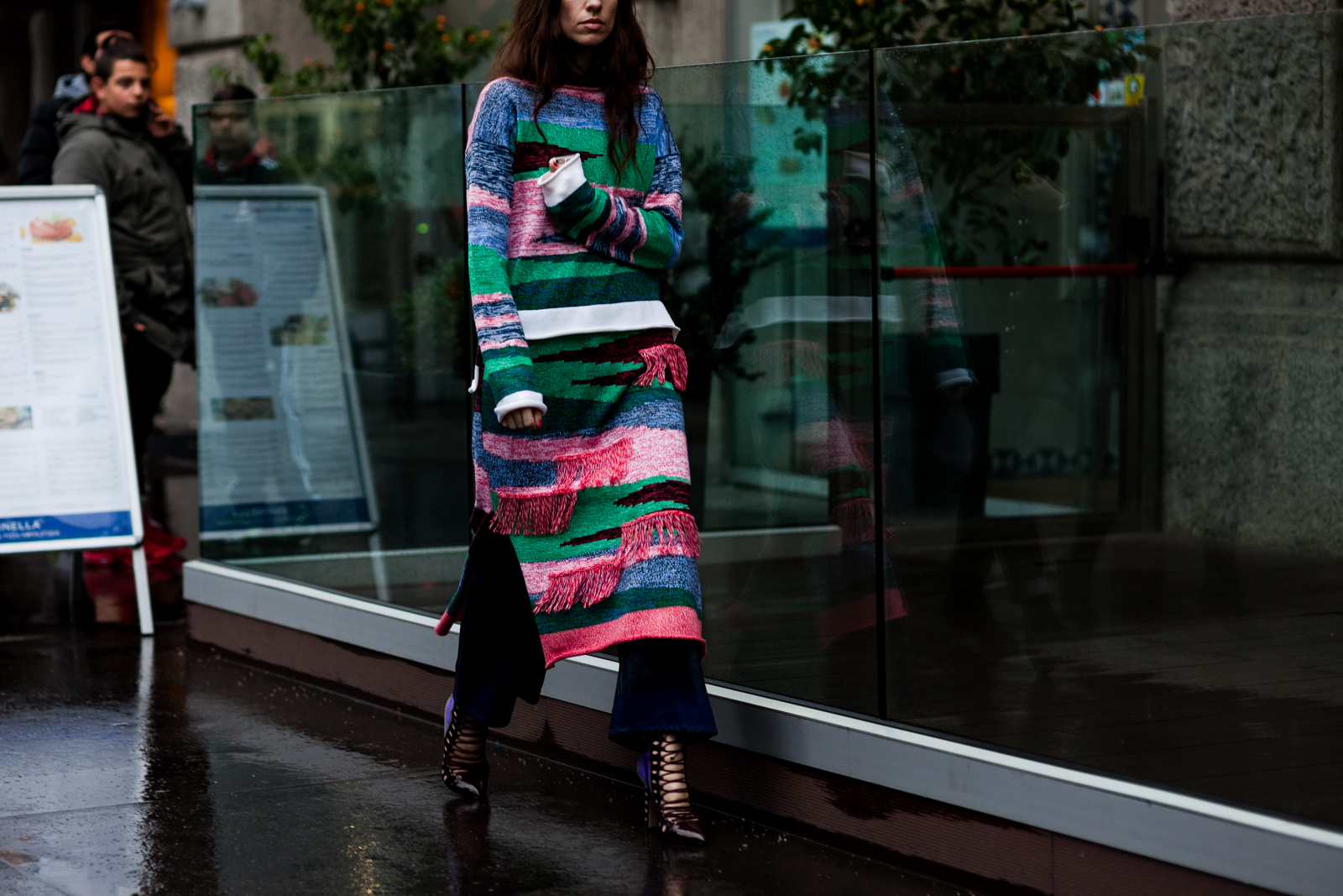 Erika Boldrin wearing a long knitted sweater by Ports1961 and Paula Cademartori shoes before a show in Milan, Italy