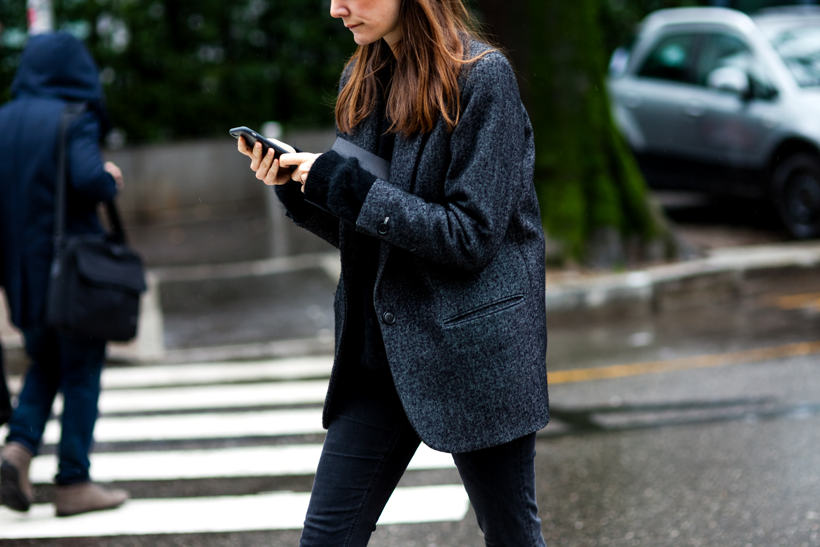 Woman wearing jeans and blazer before the Armani show in Milan, Italy