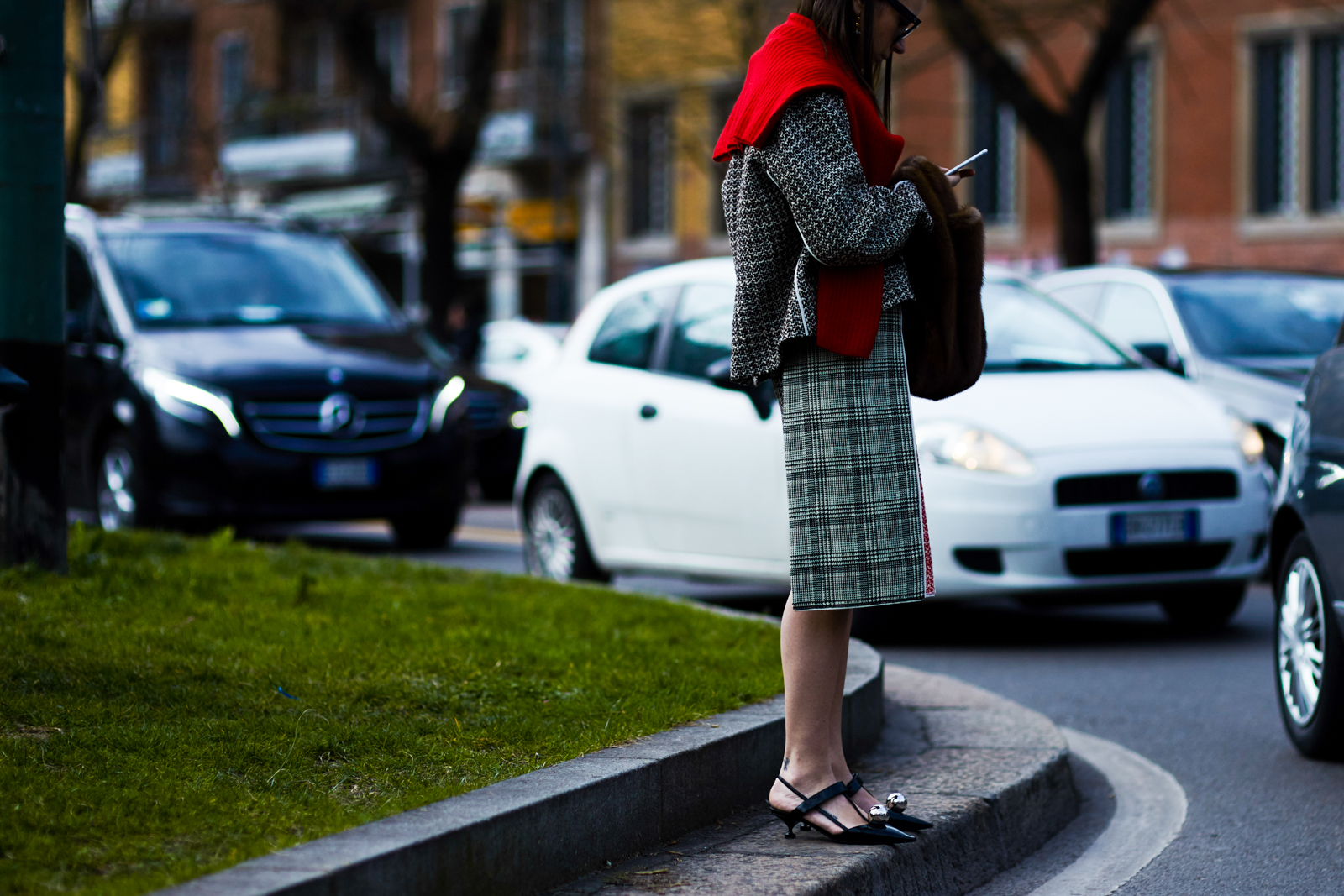 MFW Street Style: Russian stylist Natasha Goldenberg wearing a Prada outfit and a fur bag after a fashion show in Milan, Italy