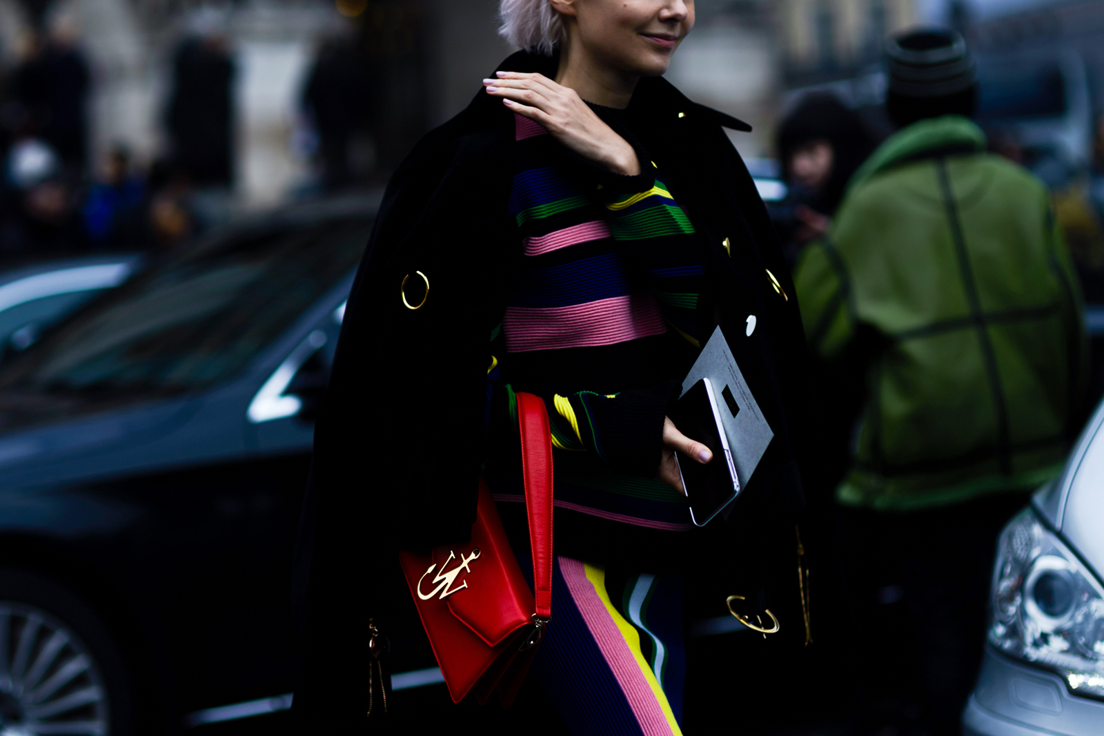PFW Street Style: Russian store owner Olga KarputOlga Karput wearing a striped sweater, skirt and bag by J.W. Anderson and Thomas Tait jacket in Paris