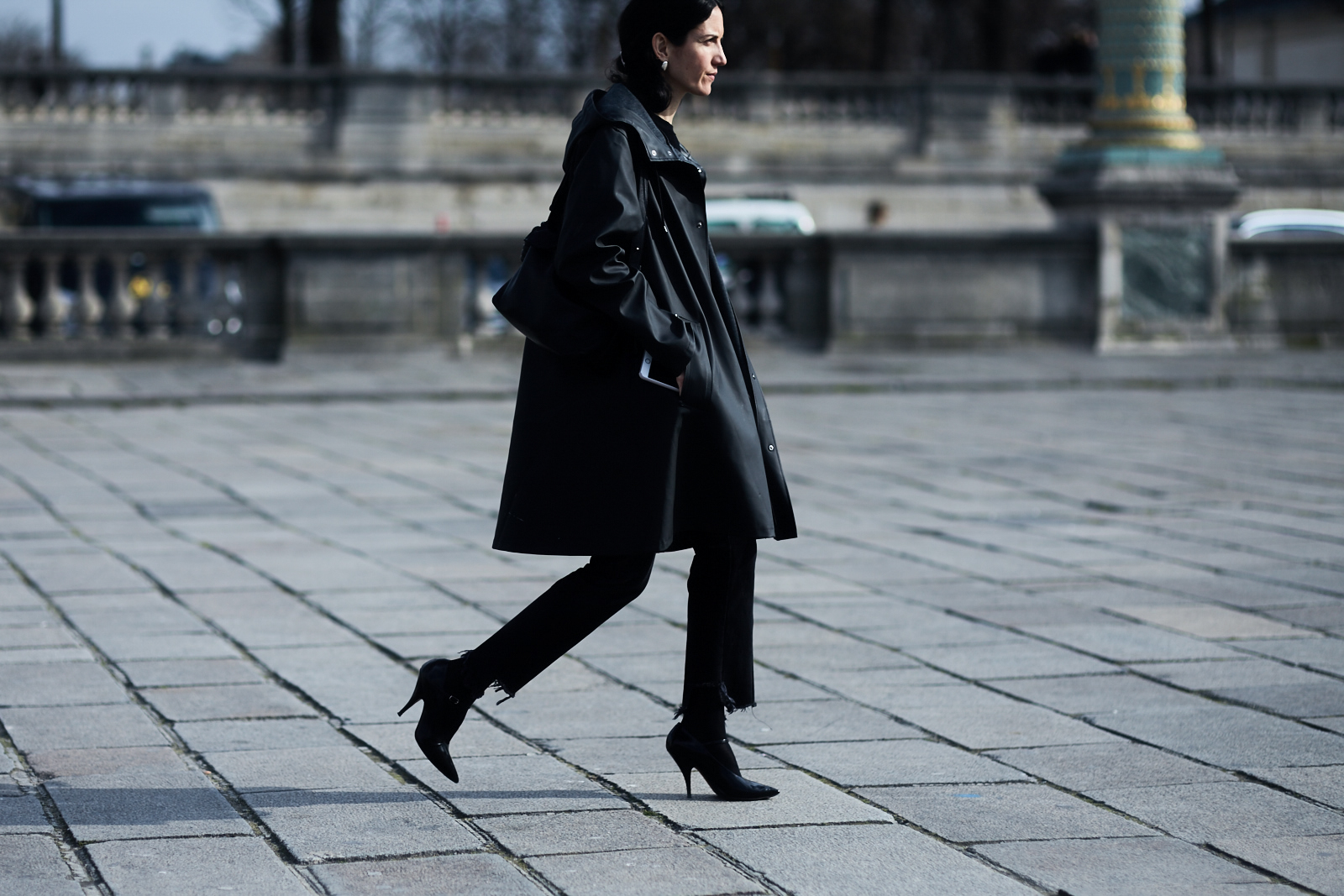 A woman wearing Vetements jeans and coat before the Valentino Fall/Winter 2016-2017 fashion show in Paris, France
