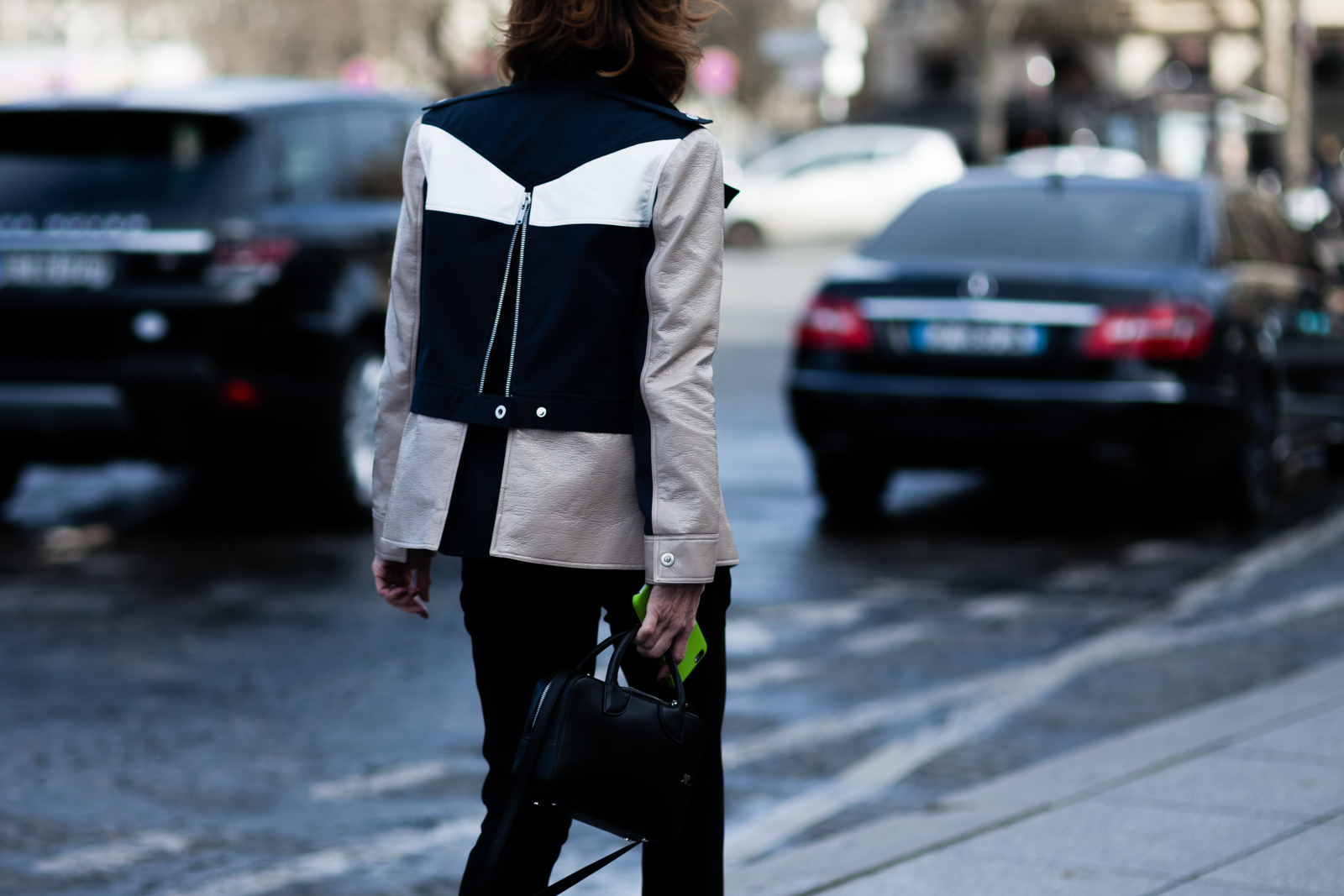 A woman wearing a Courrèges jacket after the Courrèges Fall 2016 fashion show in Paris, France