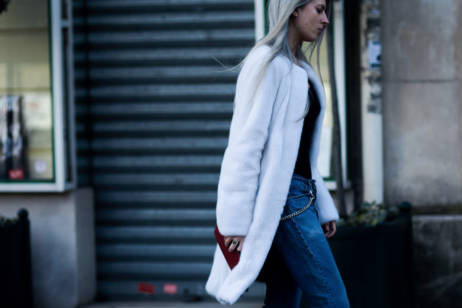 PFW Street Style: Vogue UK's Sarah Harris wearing a white fur coat and Robert Clergerie slippers after a show in Paris, France