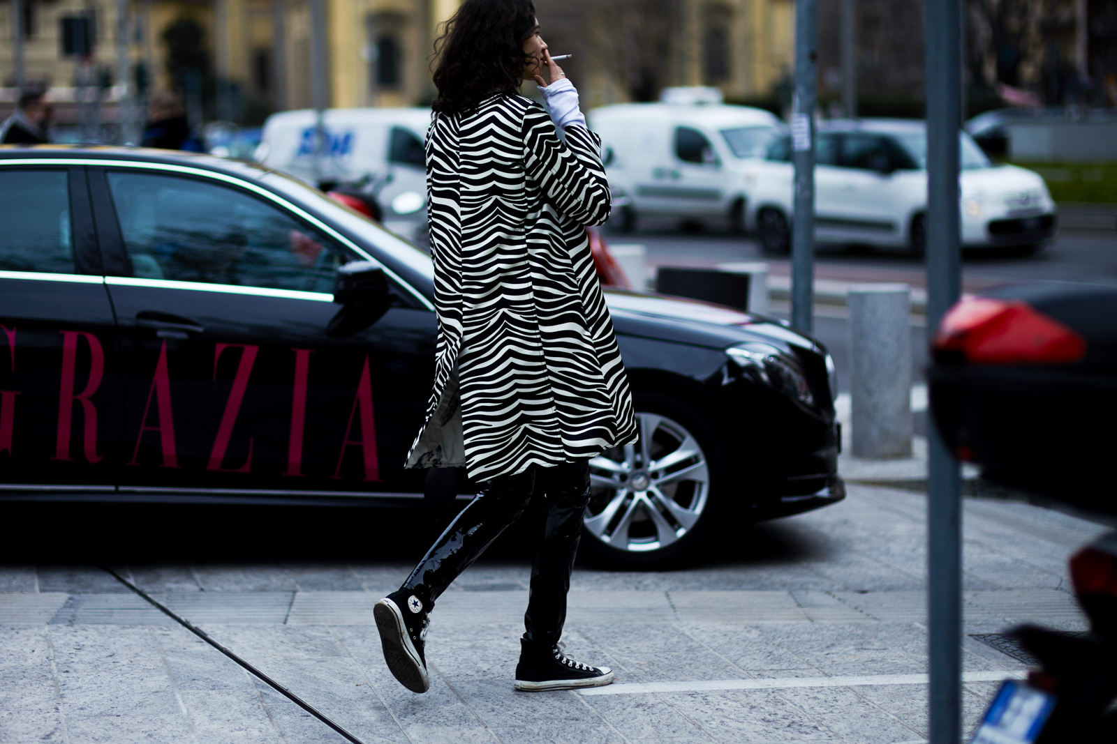 MFW Street Style: Fashion editor Stella Greenspan wearing a Celine coat and Converse sneakers before a fashion show in Milan, Italy
