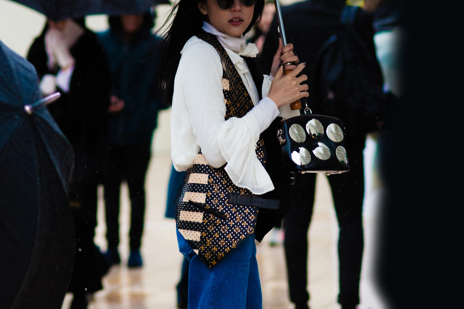 Yoyo Cao wearing Louis Vuitton and Off-White jeans before the Louis Vuitton Fall/Winter 2016-2017 fashion show in Paris, France