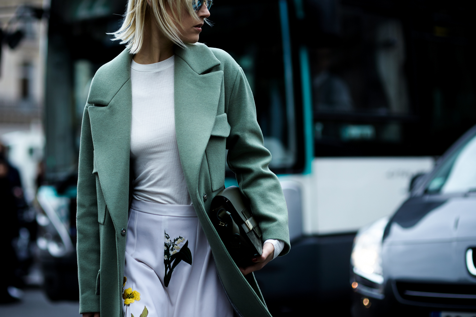 PFW Street Style: Fashion blogger Linda Tol wearing a green coat and printed pants before the Stella McCartney Fall 2016 fashion show in Paris, France