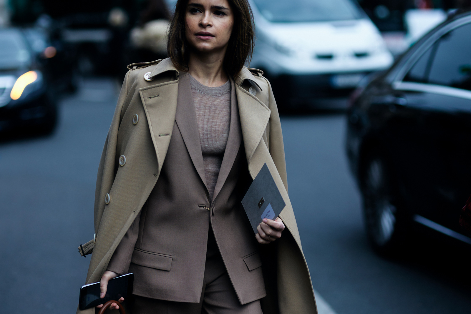 PFW Street Style: Mira Duma wearing a trench coat and a beige suit after the Stella McCartney Fall 2016 fashion show in Paris, France