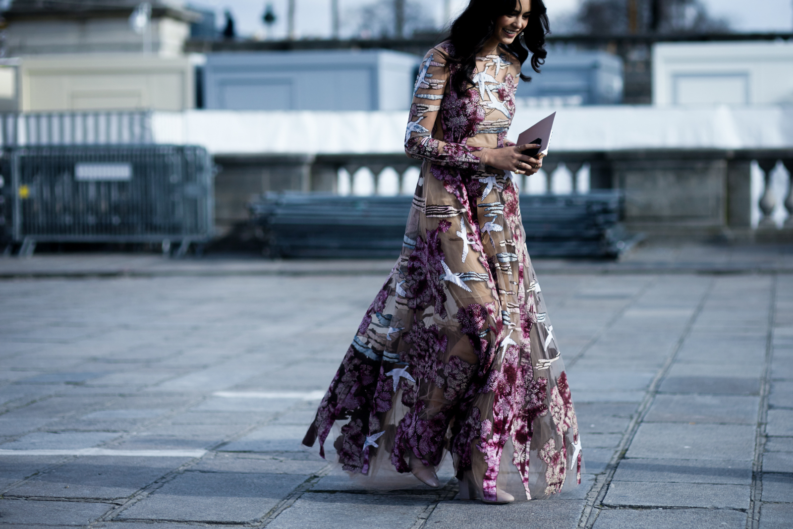 A woman wearing a long Valentino dress before the Valentino Fall/Winter 2016-2017 fashion show in Paris, France
