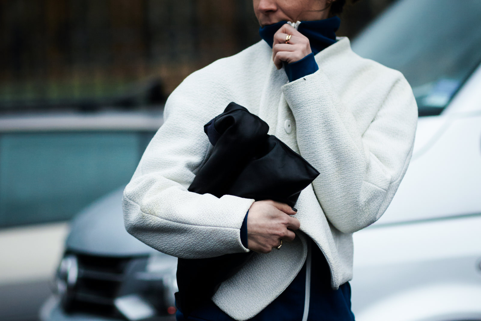 PFW Street Style: Blogger Irina Lakicevic wearing a white jacket before a fashion show at Paris fashion week.