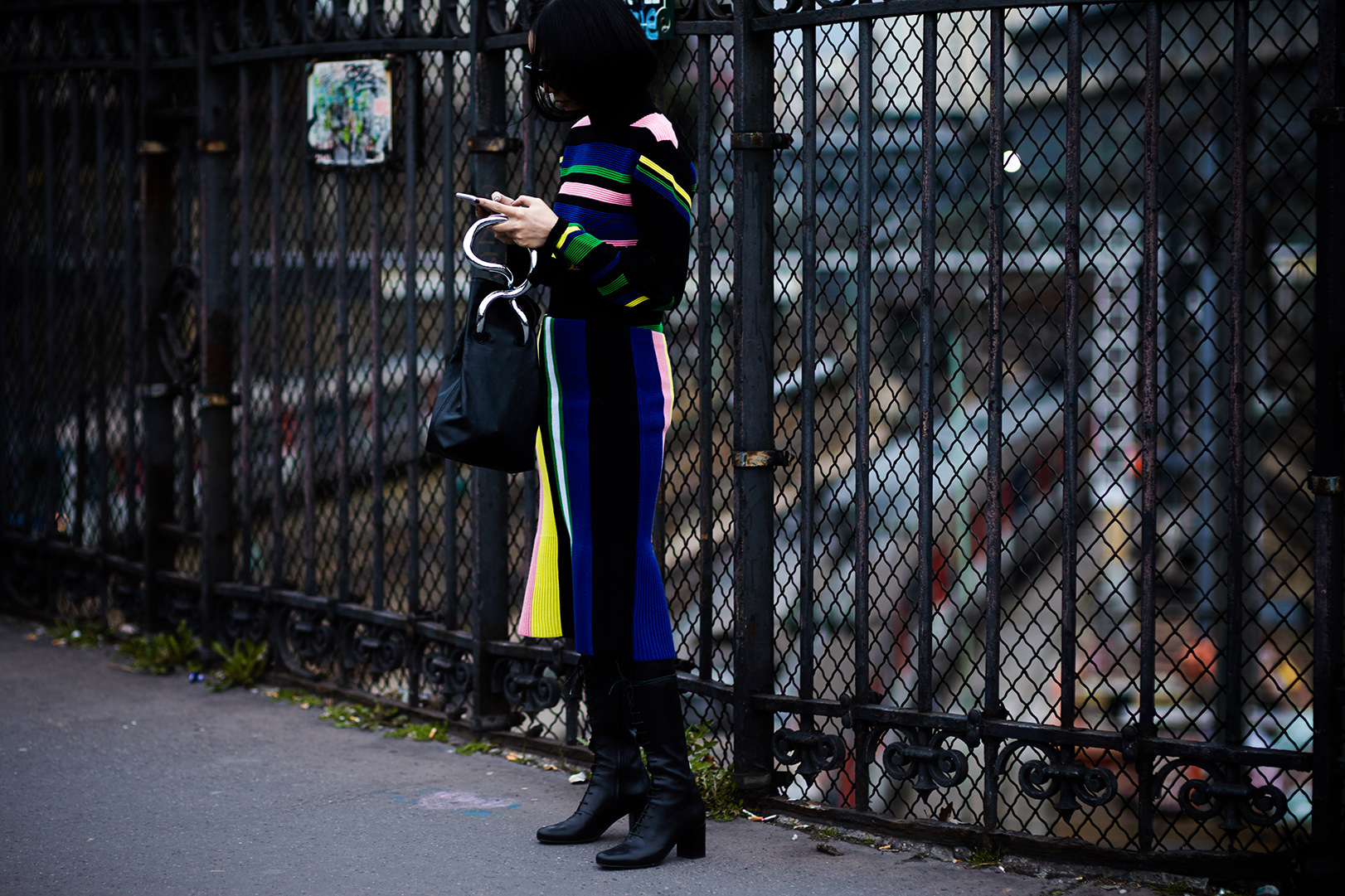 PFW Street Style: Yoyo Cao wearing a striped sweater, skirt and bag by J.W Anderson before a fashion show at Paris Fashion Week