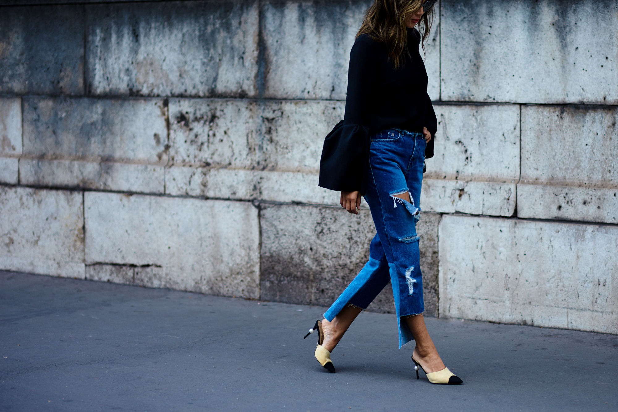 PFW Spring-Summer 2017 Street Style: Blogger Aimee Song wearing a bell-sleeved top, jeans and Chanel mules after a fashion show in Paris, France