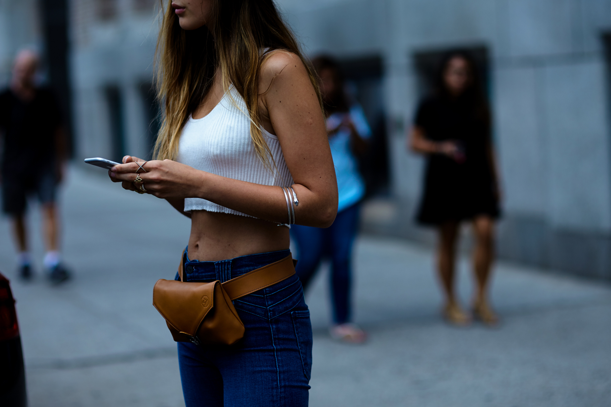 NYFW Spring-Summer 2017 Streetstyle: Doina Ciobanu wearing a belt bag and jeans before  a show in New York, September 2016