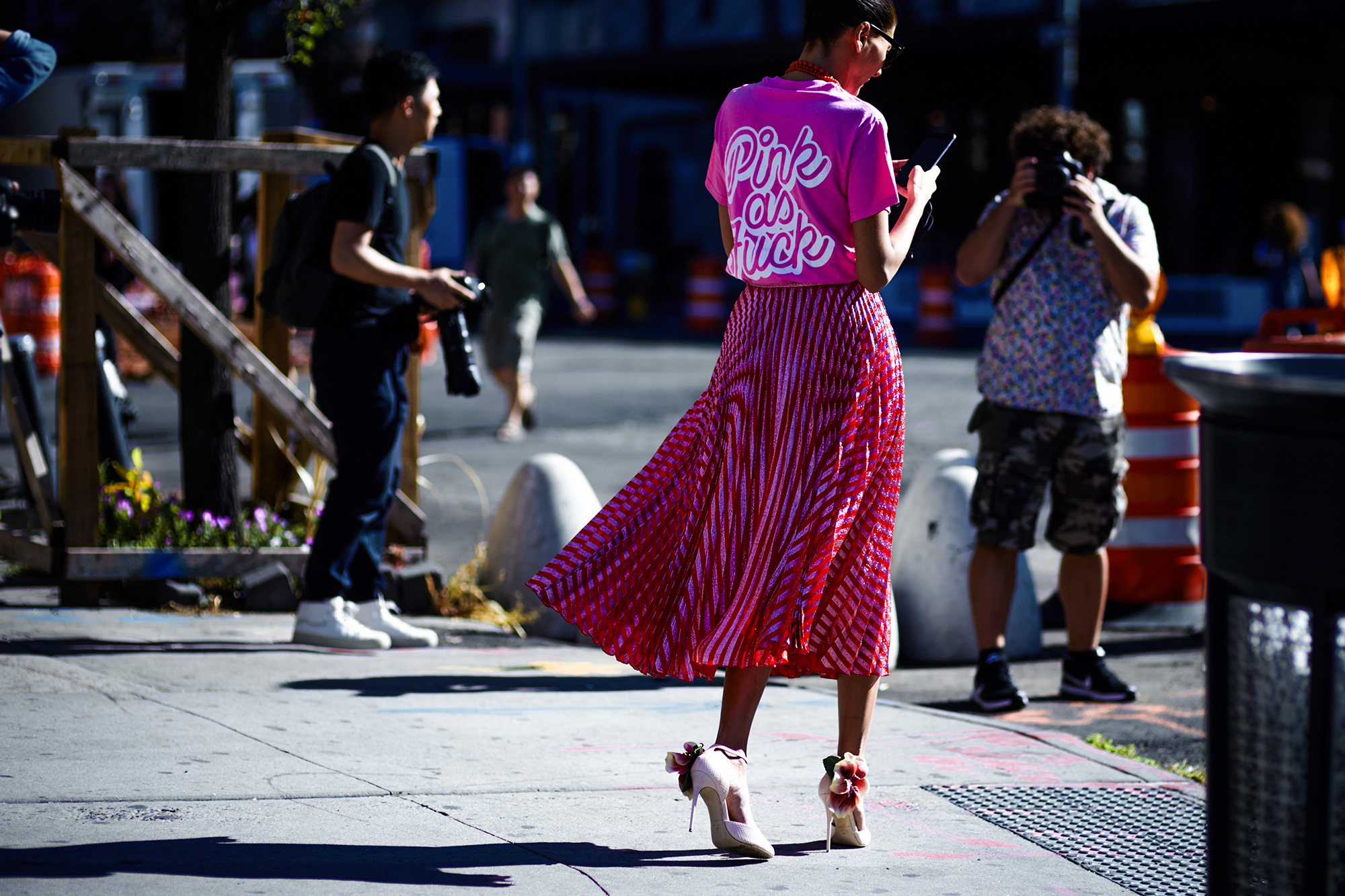 NYFW Spring-Summer 2017 Streetstyle: Giovanna Battaglia Engelbert wearing a "Pink as Fuck" T-Shirt and a Gucci pleated skirt after a show in New York