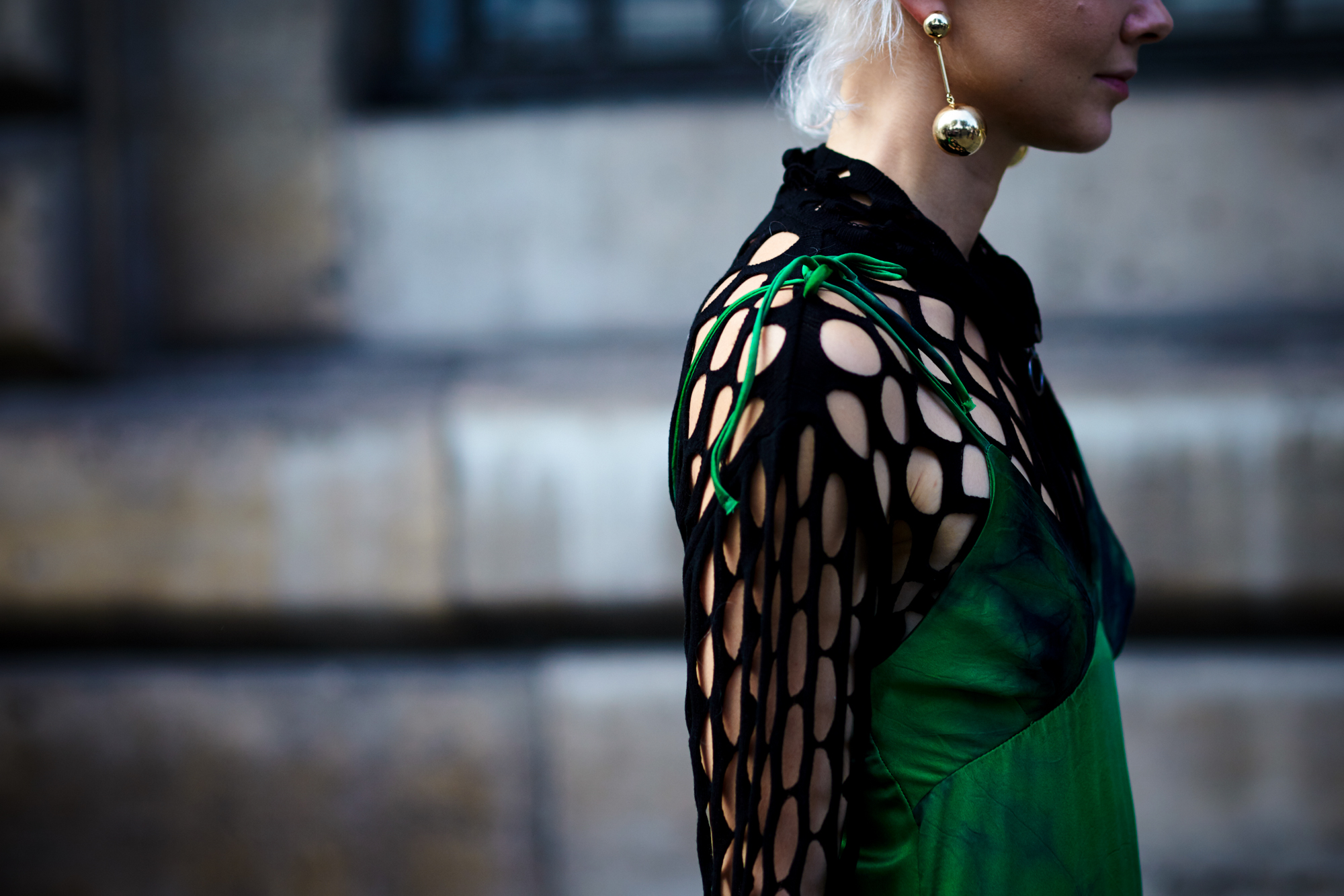 PFW Spring-Summer 2017 Street Style: Olga Karput wearing a green Marques Almeida dress and J.W.Anderson earrings after the Courreges fashion show in Paris