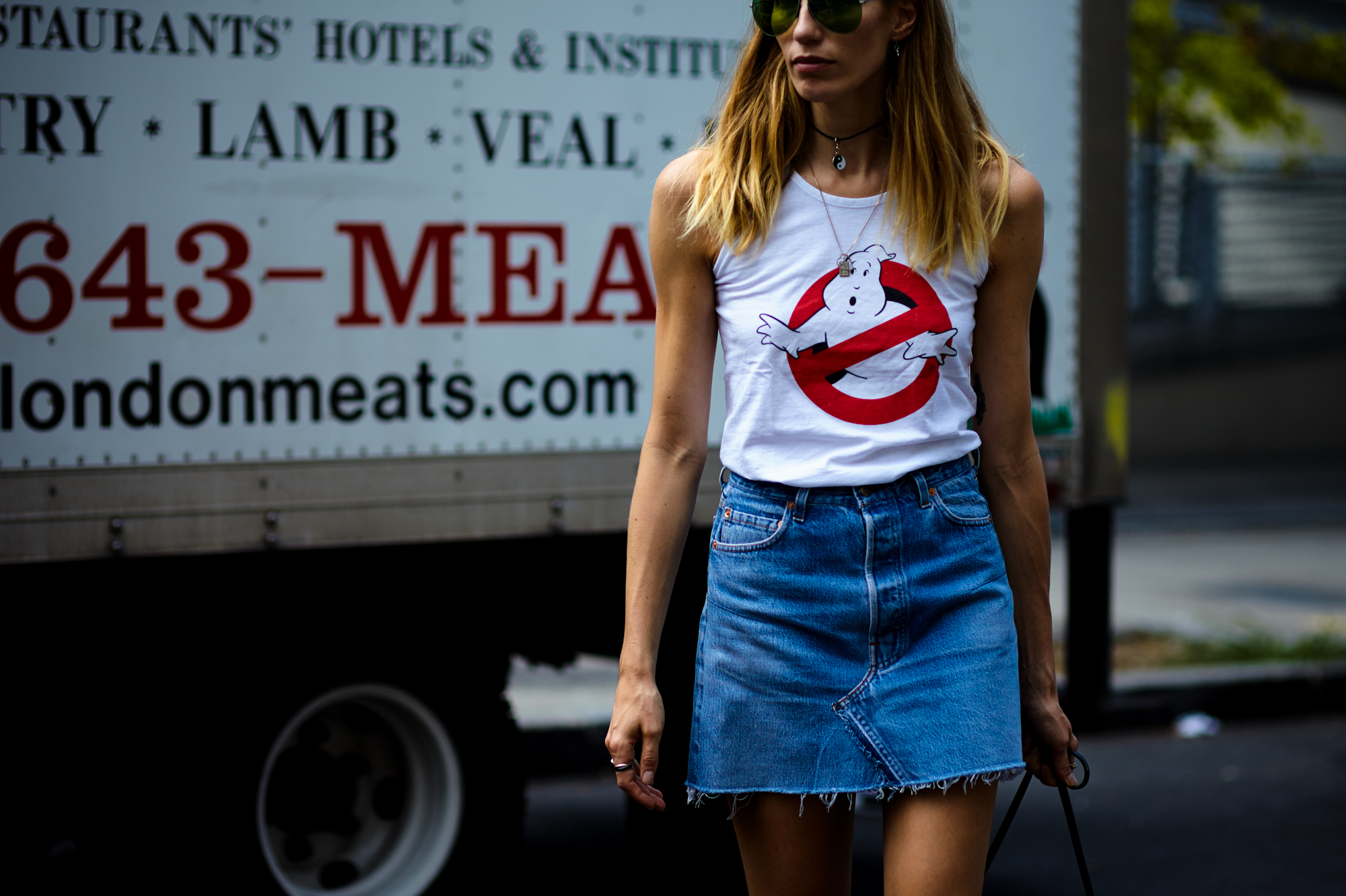 NYFW Spring-Summer 2017 Streetstyle: Fashion Stylist Veronika Helbrunner wearing a white top and denim mini skirt after a show in New York City