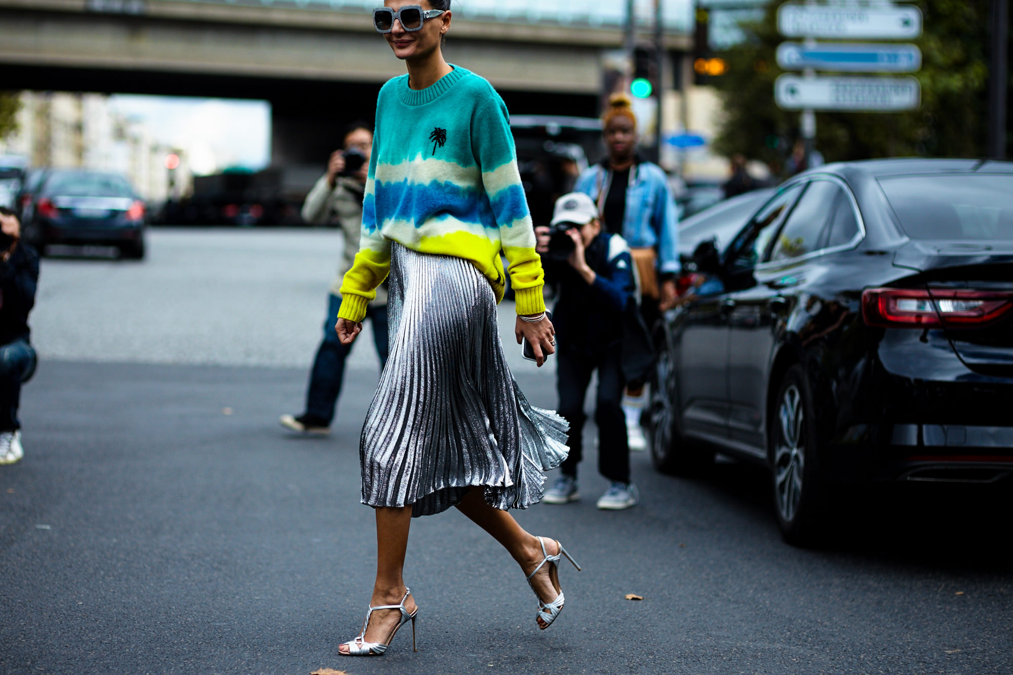 PFW Spring-Summer 2017 street style: Giovanna Battaglia Engelbert wearing a graphic sweated and silver pleated skirt after a show in Paris.
