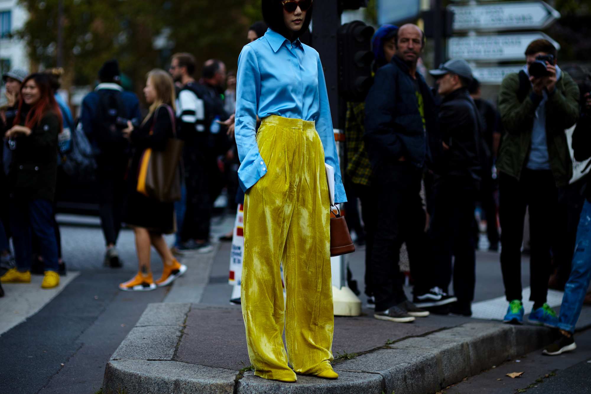 PFW Spring-Summer 2017 Street Style: Yoyo Cao wearing a blue shirt and yellow velvet pants by Celine before the Celine SS17 fashion show in Paris
