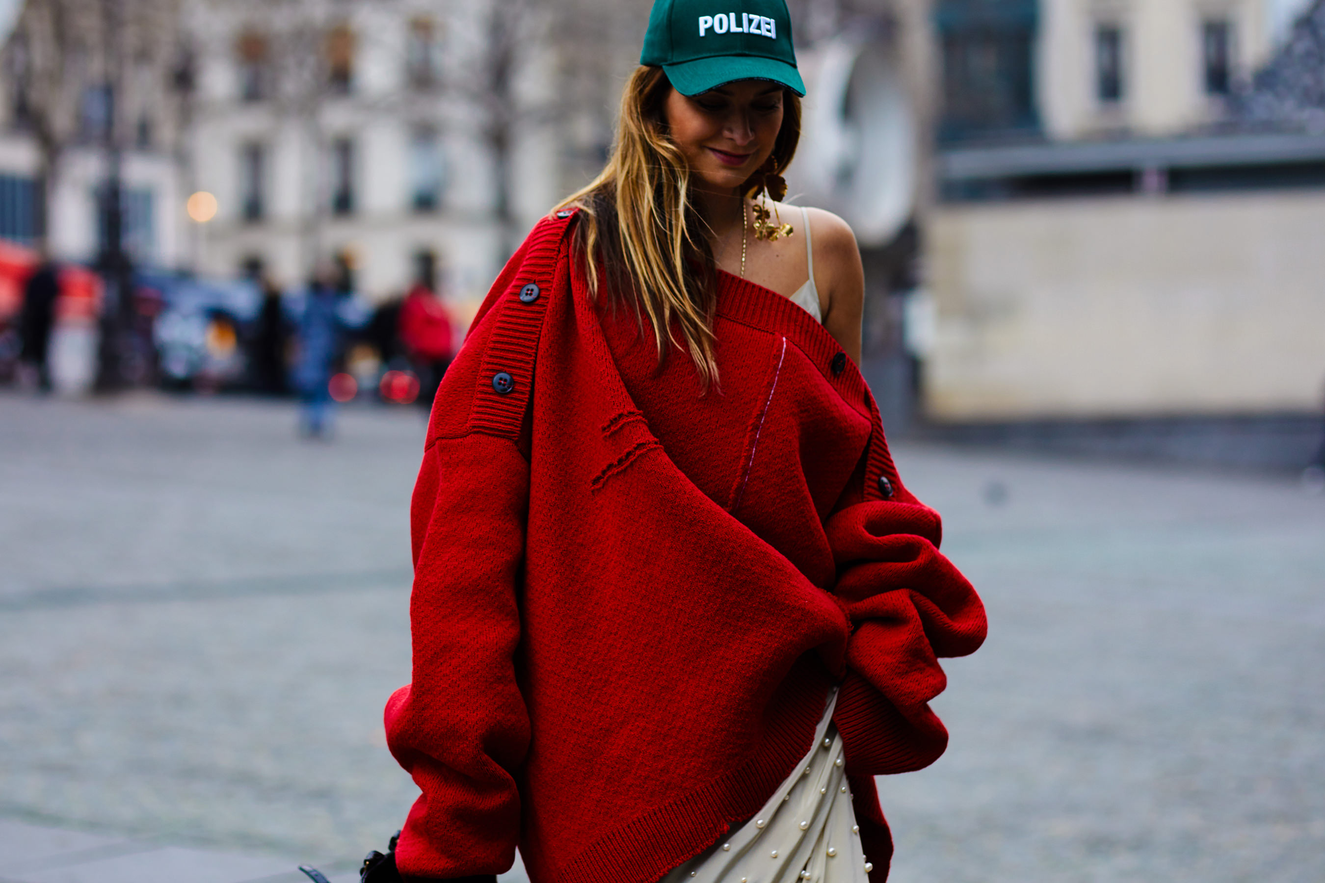 Paris Haute Couture S/S 2017 Street Style: Luisa Fernanda Espinosa wearing a Raf Simons sweater and Vetements hat before the Vetements FW 17/18 Fashion Show